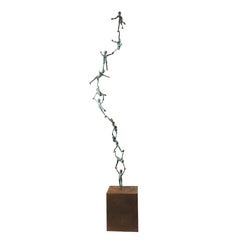 Double colonne - Sculpture en bronze avec acrobats d'enfants empilés, patine verte