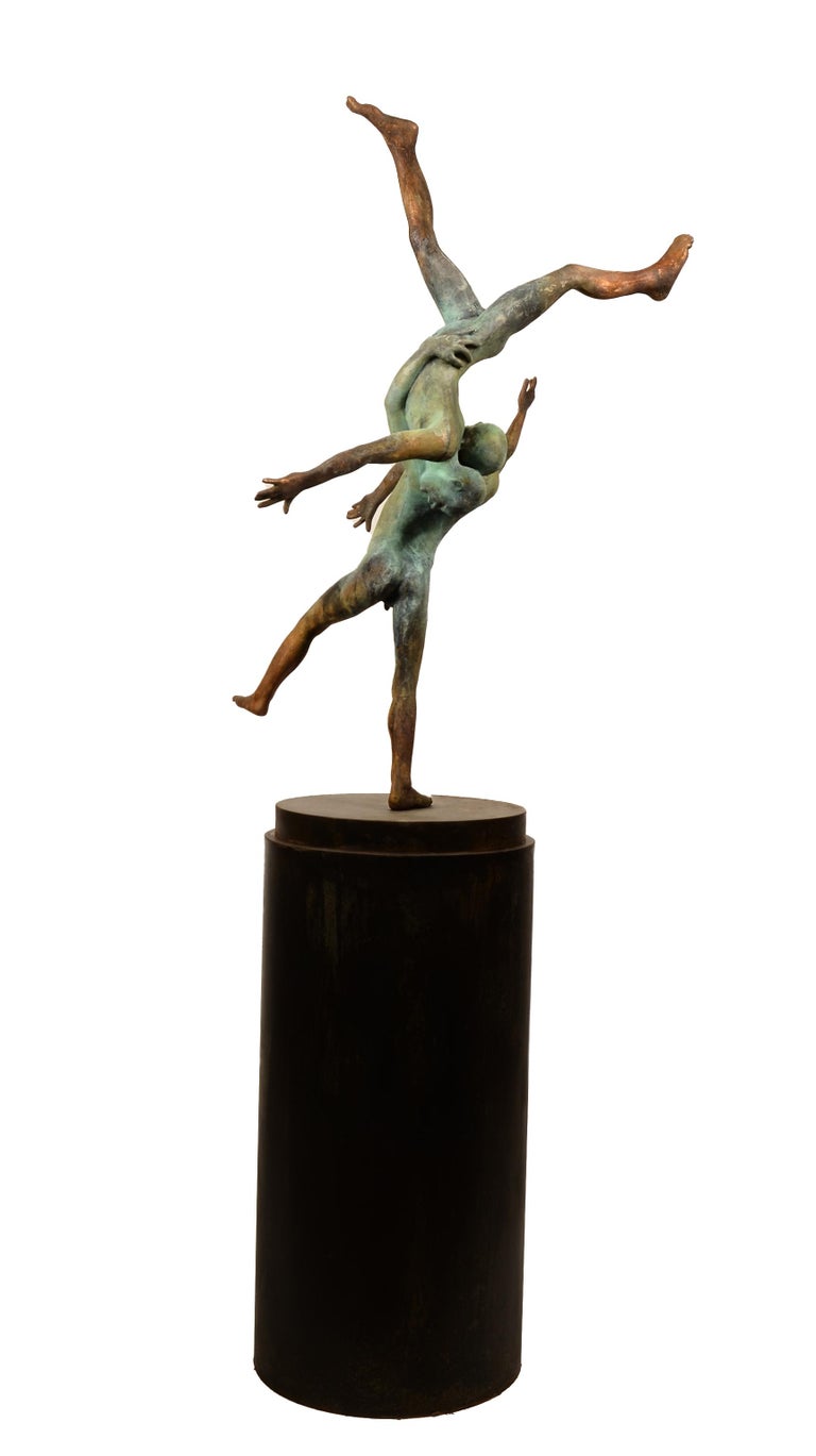 Inspired by the great Renaissance Sculptors,  Curiá brings that classical form into the modern era.  The fluid movement of the acrobats is captured in a fleeting moment, suspended in time.  The two bodies have beautiful green patina that flows into