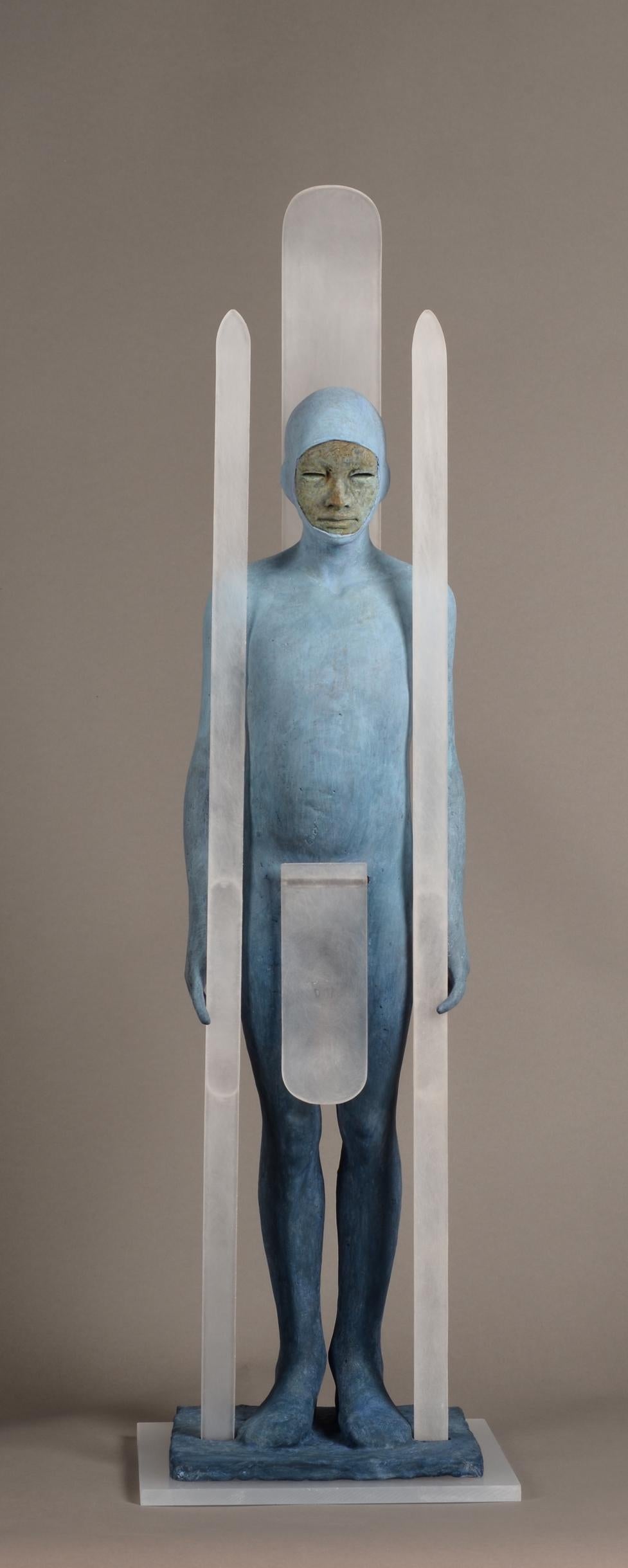 Snow - Hooded Bronze Figure with Skis, Light Blue Patina - Sculpture by Jesus Curia Perez