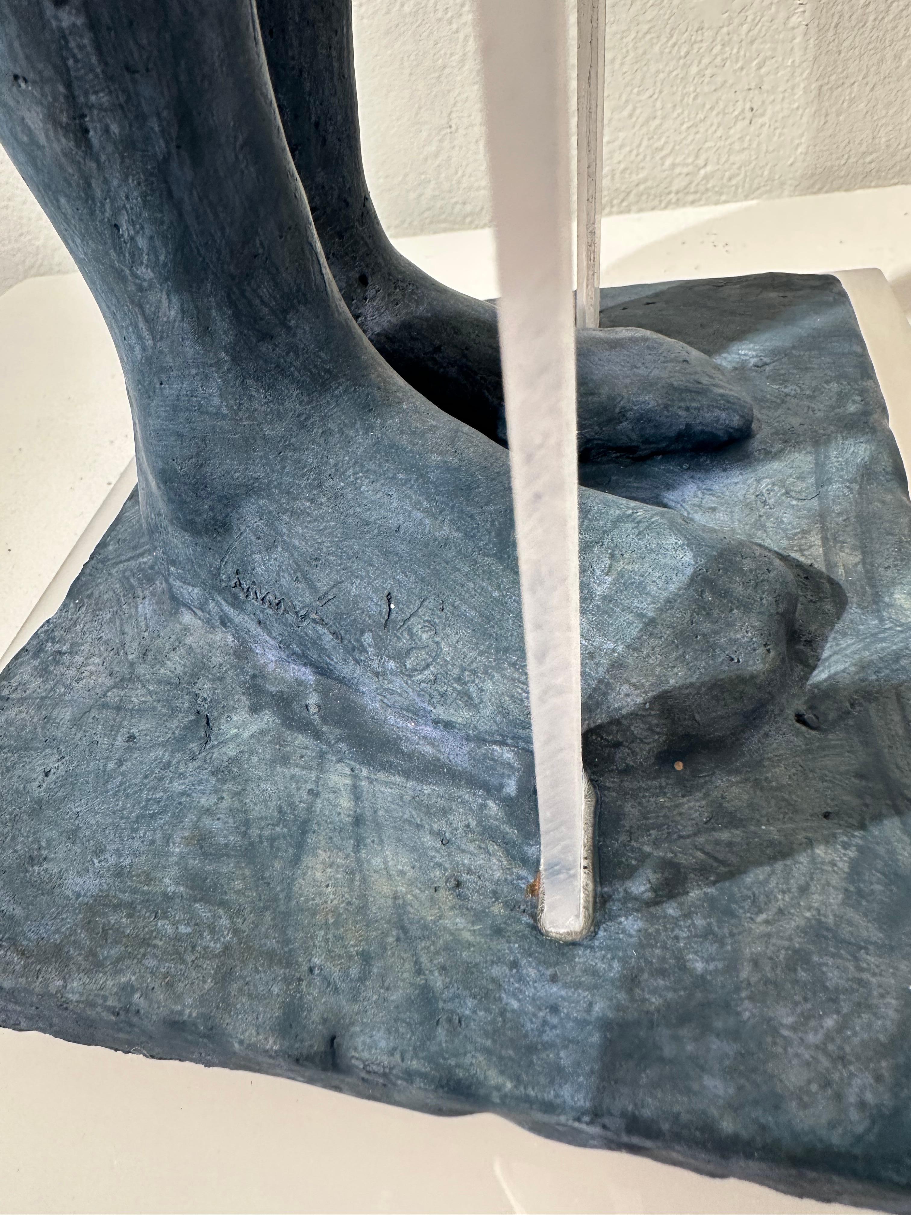 Snow - Hooded Bronze Figure with Skis, Light Blue Patina - Contemporary Sculpture by Jesus Curia Perez