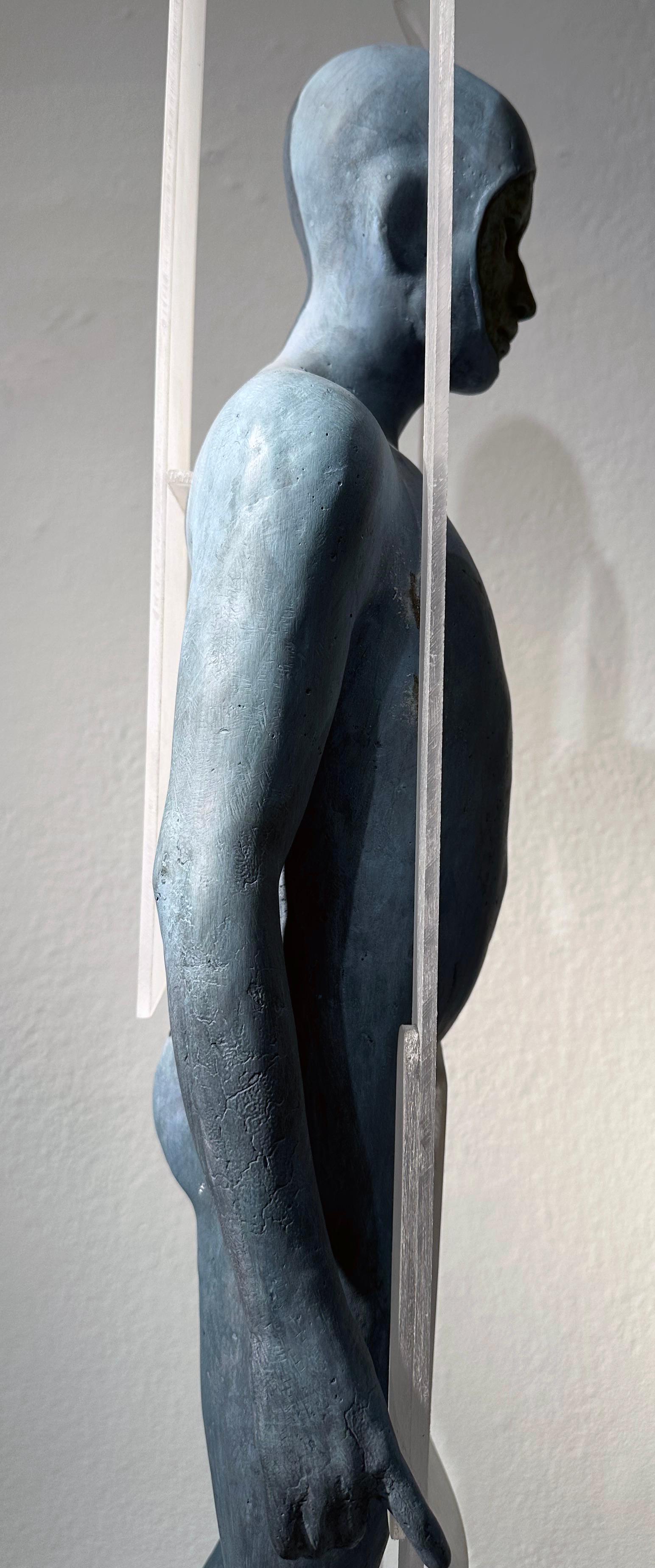 Snow - Hooded Bronze Figure with Skis, Light Blue Patina - Gold Figurative Sculpture by Jesus Curia Perez