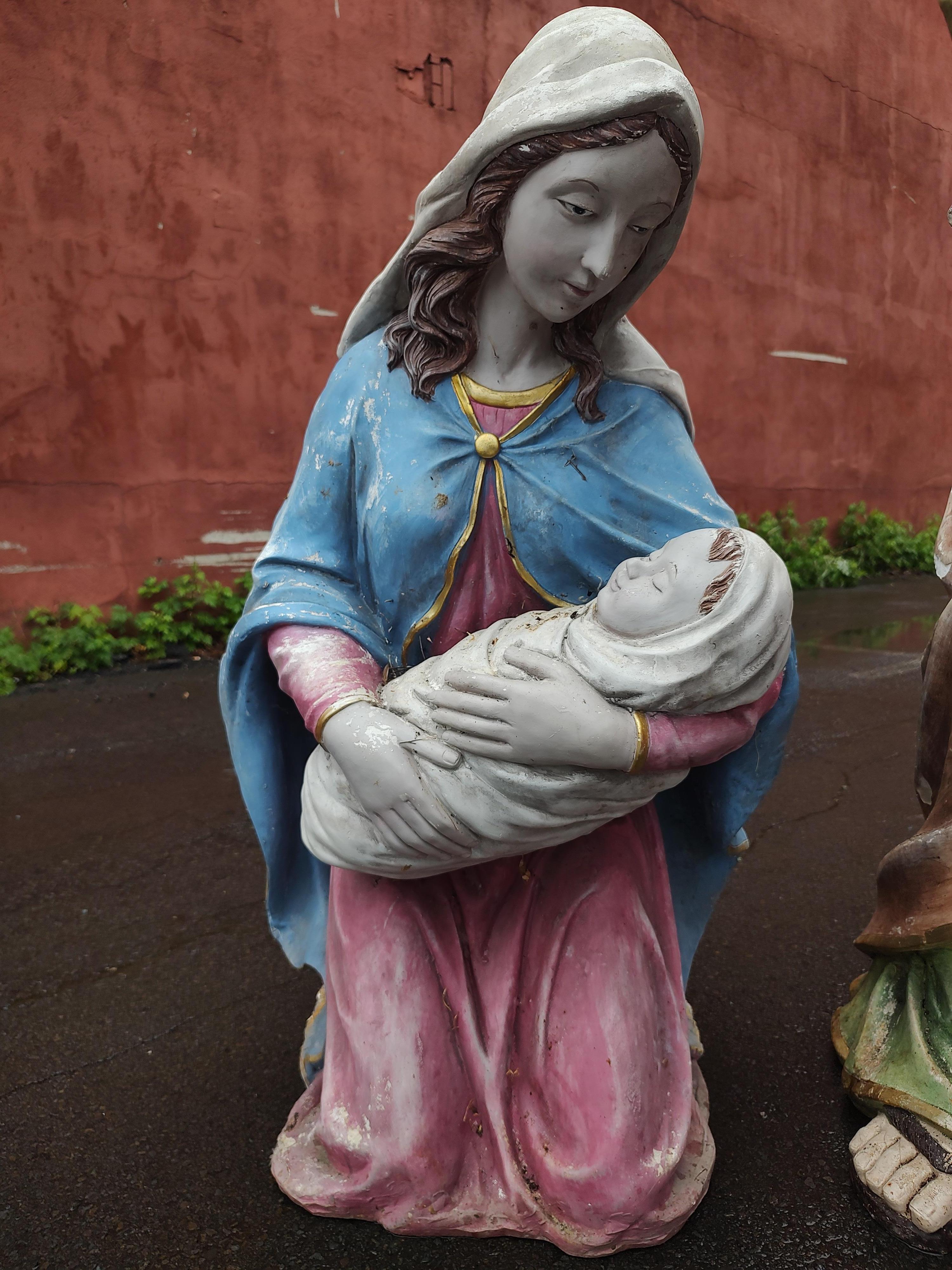 Fabulous tall life size Joseph with Mary kneeling cradling Baby Jesus in what was a nativity scene. Molded Fiberglass with a coat of plaster over and then painted. Detailed shrouded clothing with lifelike face and hands. Gilt detailing on robes.