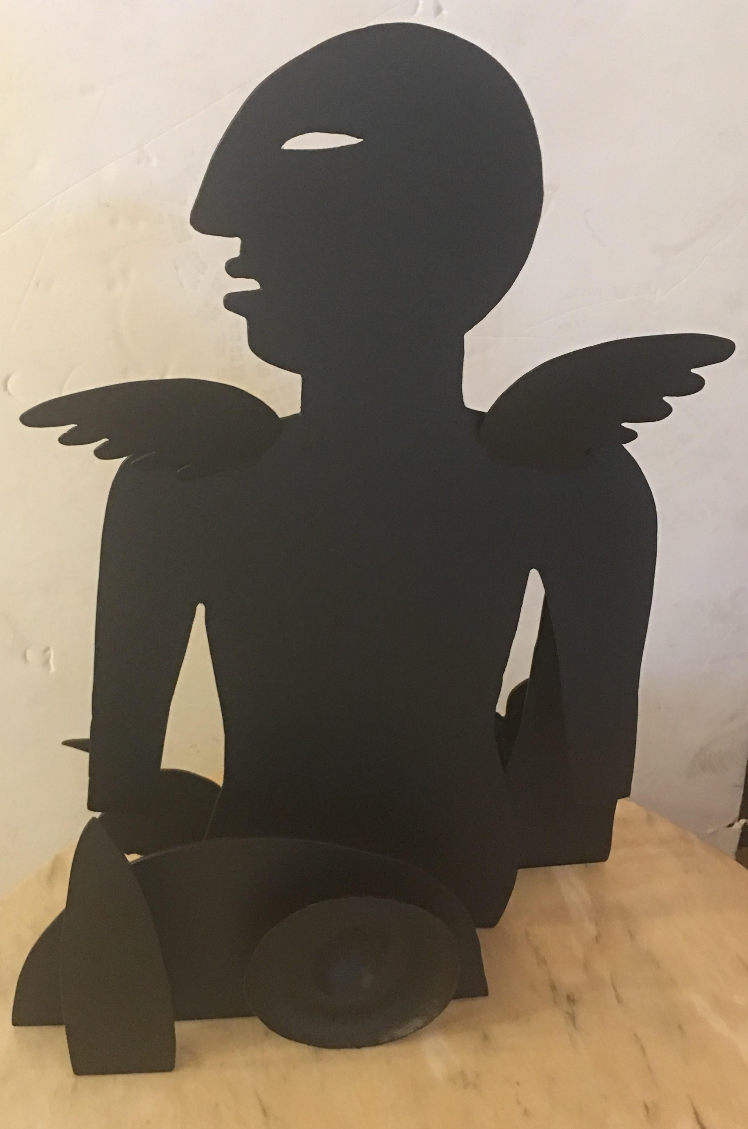 Angel sculpture in sheet metal by Mexican artist Jesus Tellosa.
Born in 1936, Tellosa grew up in Guadalajara and California. His formal art studies began at the Instituto Cultural Mexico-Nortamericano in Guadalajara (1958-1960). By the early