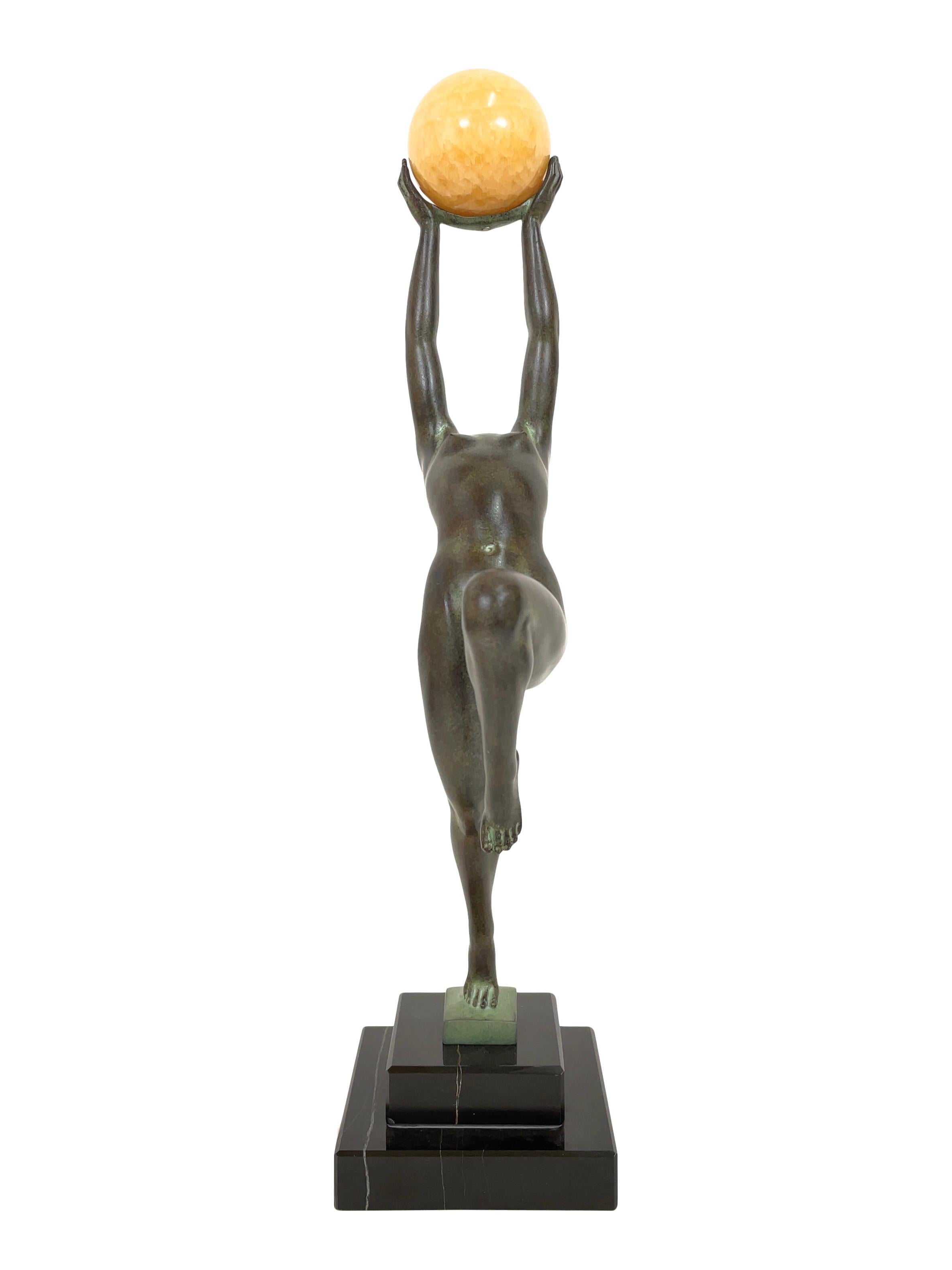Patinated Jeu Sculpture in Spelter with an Onyx Ball from Max Le Verrier in Art Deco Style