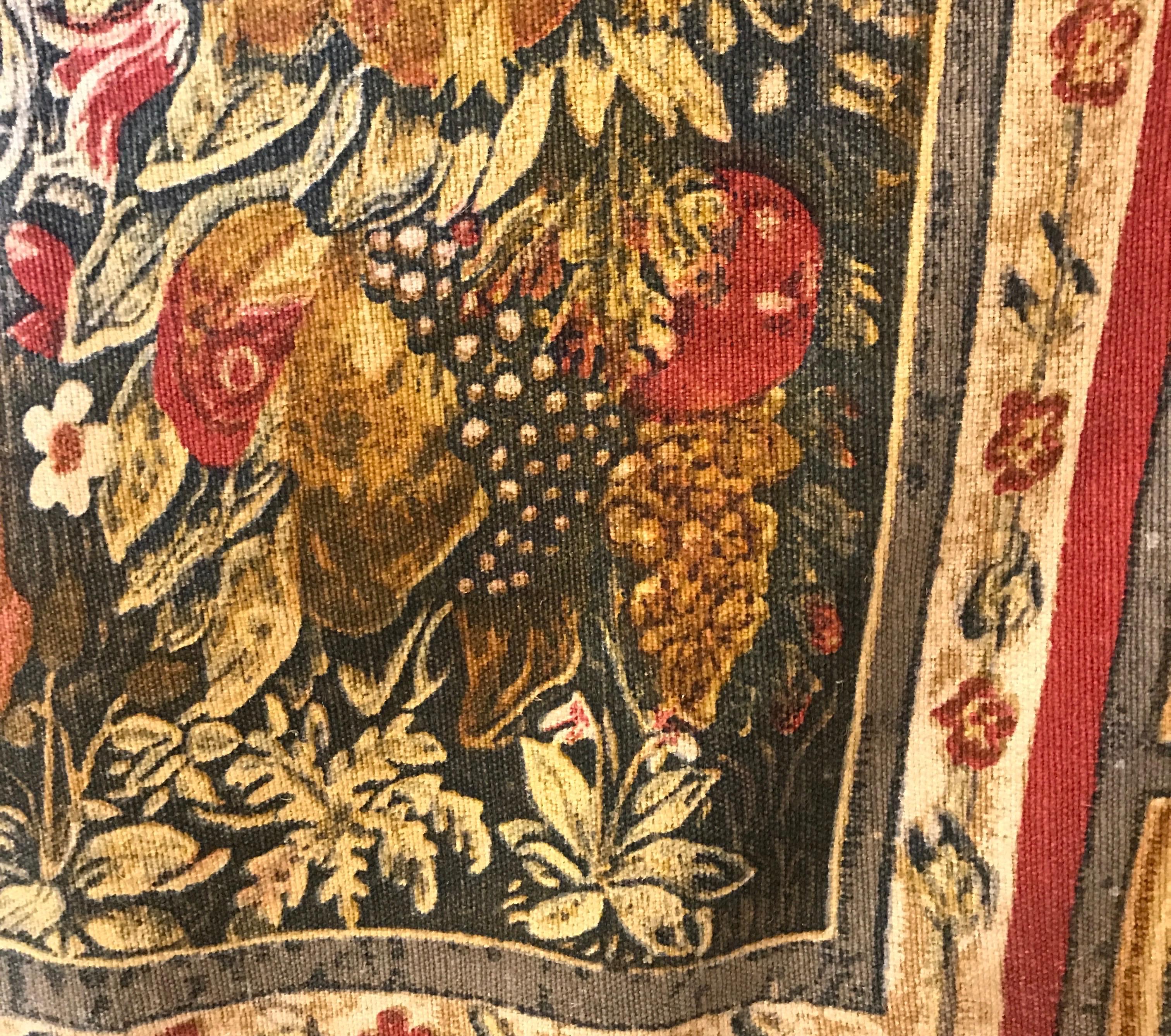 Large French tapestry depicting frolicking putti in a garden.