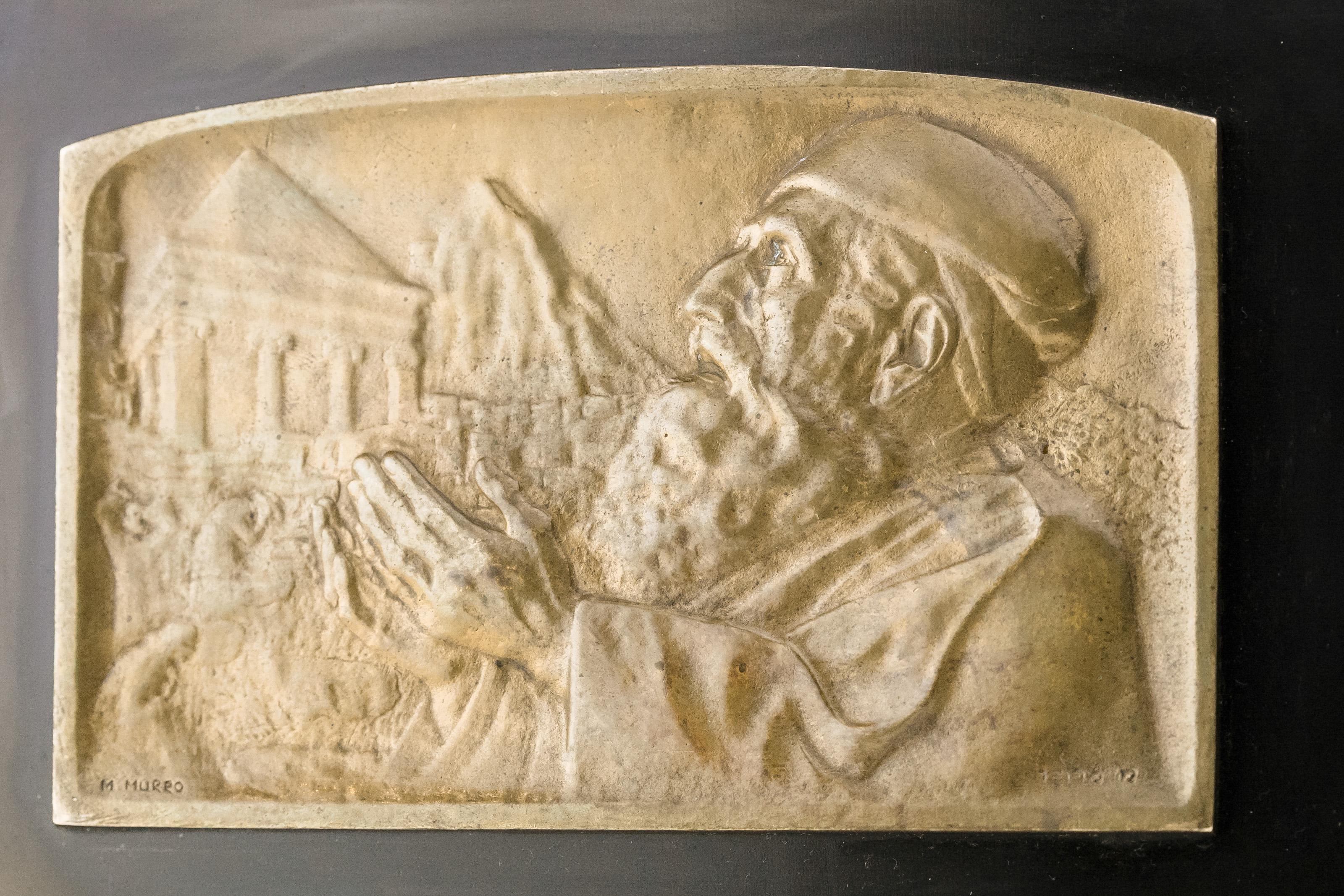 Bronze plaque with a relife of a Jew with the Tomb of Zechariah in the background.
Made in Bezalel school, Jerusalem by Moshe Murro, circa 1915.
Signed: 