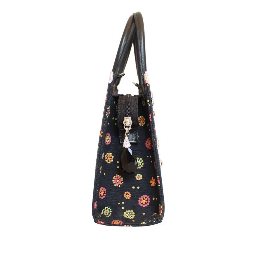 Textile Black color Multicolored inserts Floral theme Wonderful swarovski crystals applications Single leather handle Can be carried crossbody too Internal zip pocket Cm 23 x 18 x 8 (9 x 7 x 3.14 inches)

