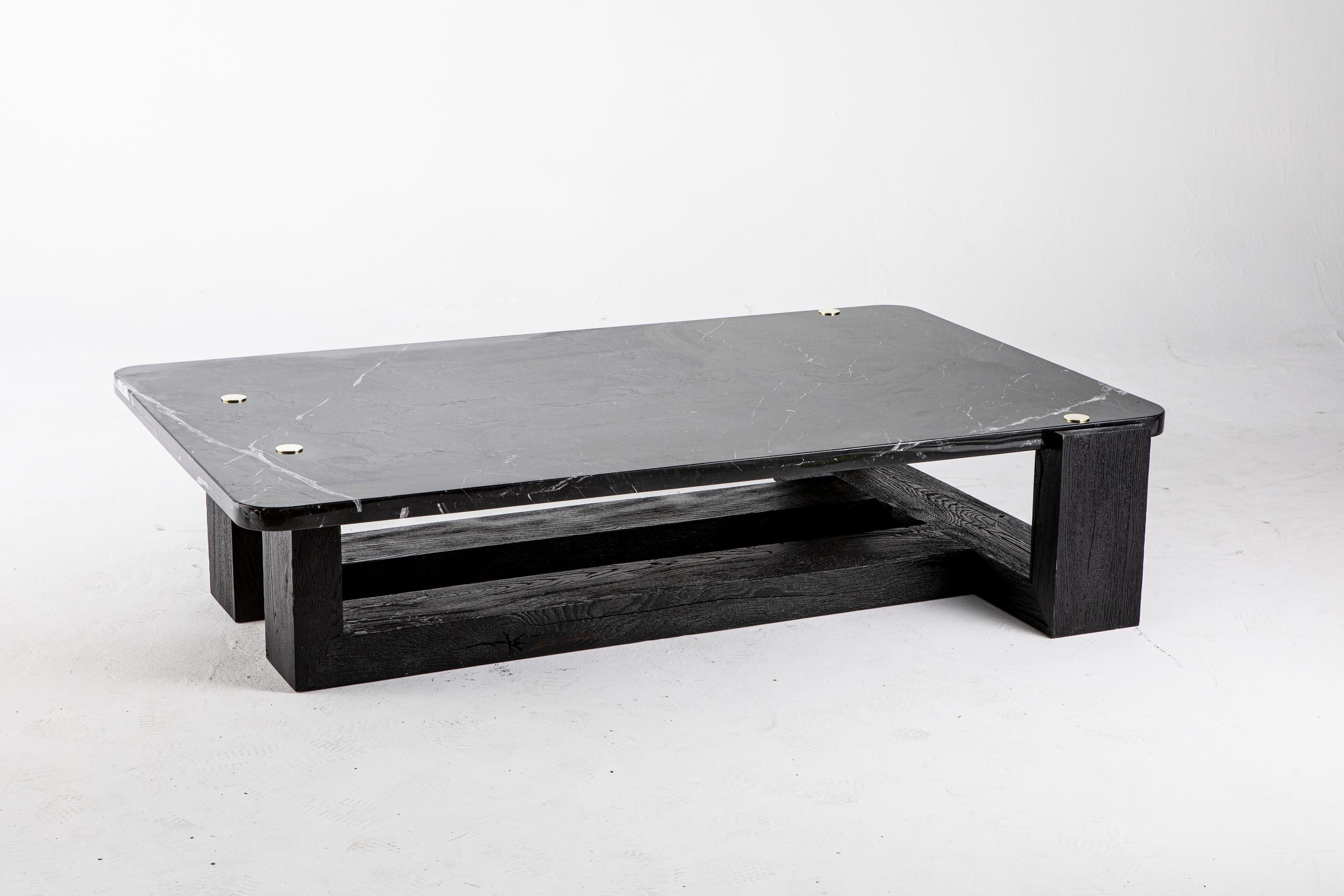 Jewel coffee table by Egg Designs
Dimensions: 170 L X 110D X 37 H cm
Materials: Solid Blackened Oak Cant, Brass, Nero Maquena Marble

Founded by South Africans and life partners, Greg and Roche Dry - Egg is a unique perspective in contemporary