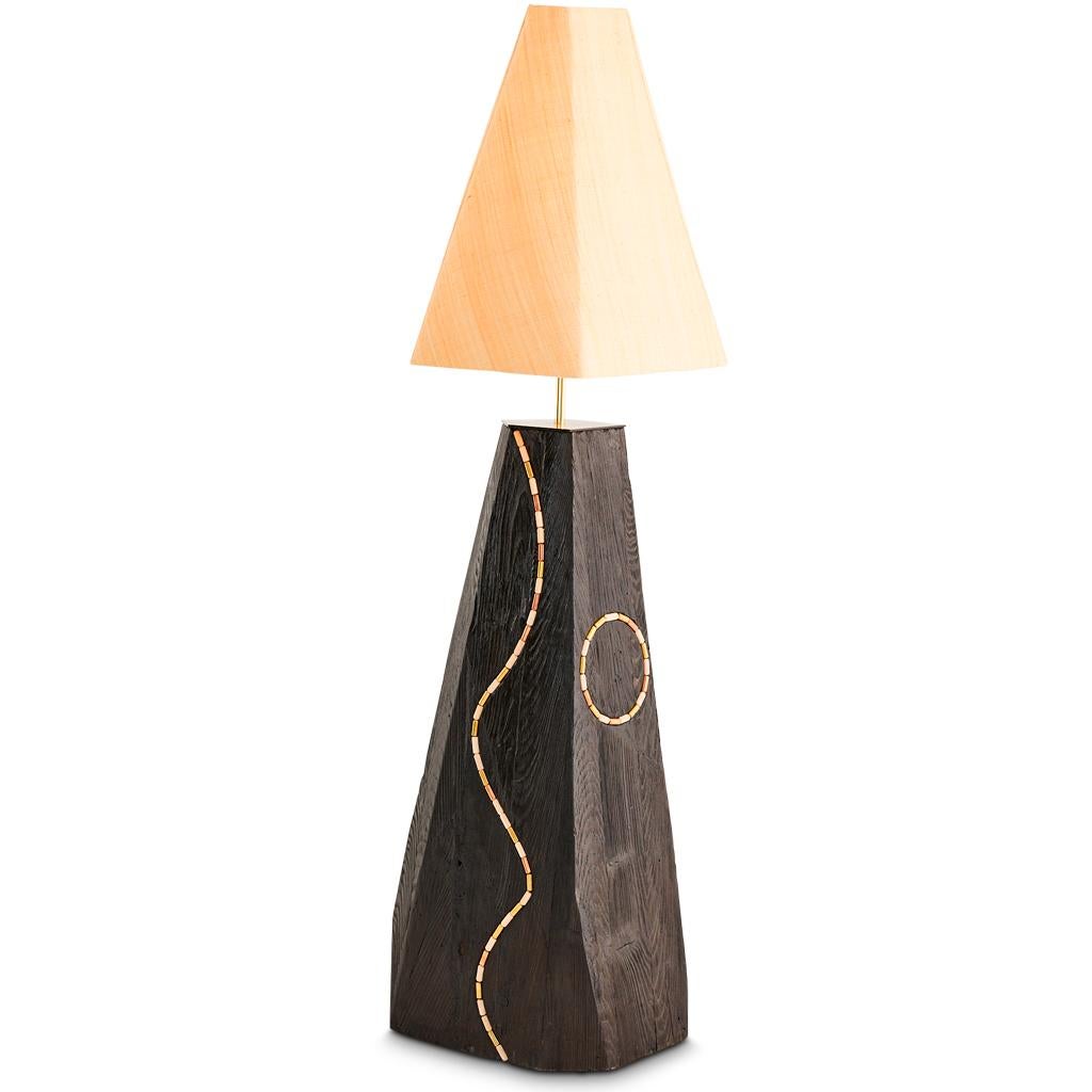The Jewel bespoke floor lamp is designed by Egg Designs and hand crafted in South Africa. 

The Jewel lamp is crafted with a Shou Sugi Ban Oak base which id polished to achieve a lustrous surface. Inset into the base are hand turned solid copper,
