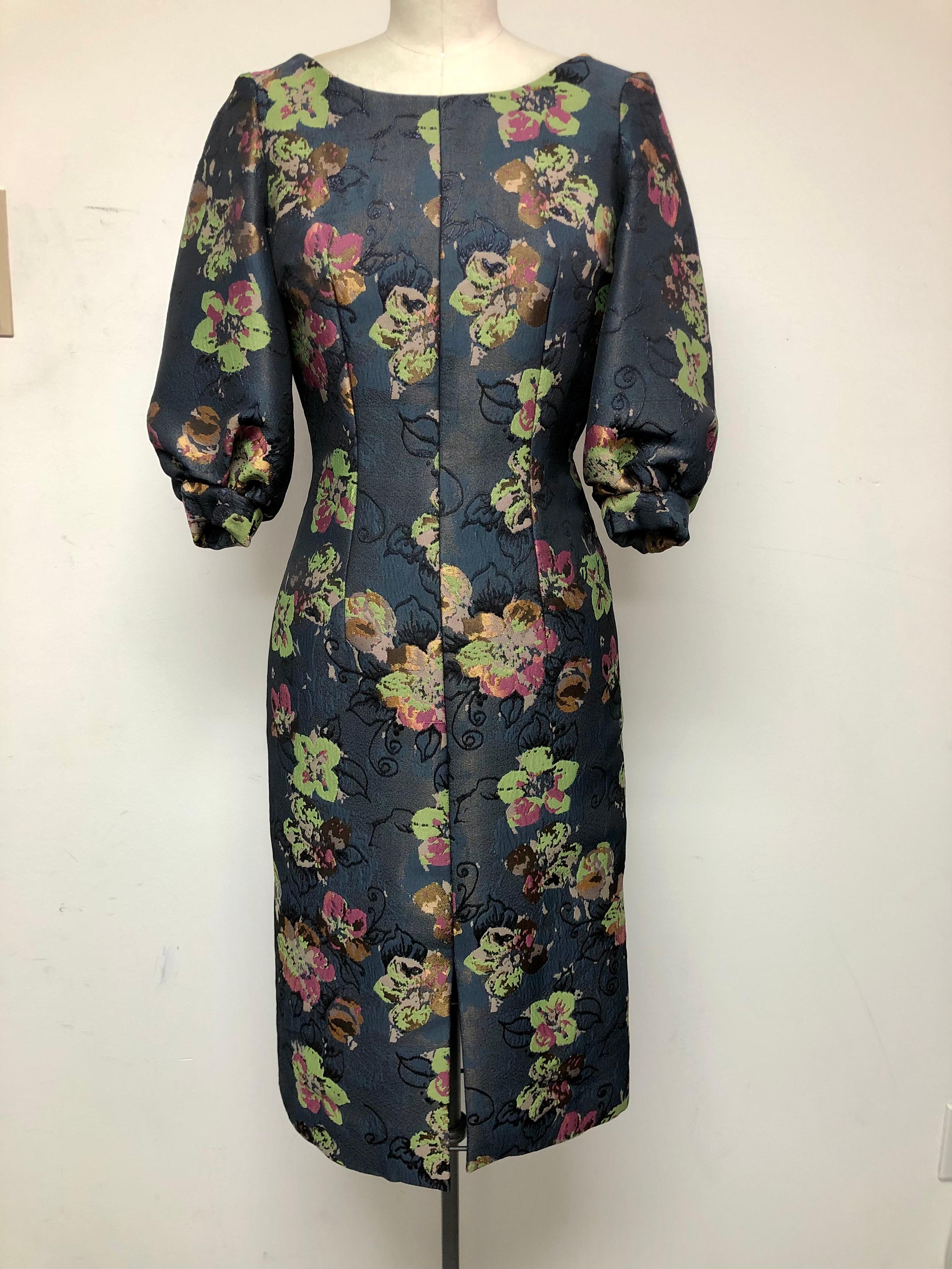 A timeless classic Slim Dress with Jewel Neck and Full Sleeve. A dress that goes perfectly from day into evening.
Unique abstract floral in autumnal colors on a light charcoal ground. Great for meetings, the office and dinner.
Can work for cocktails