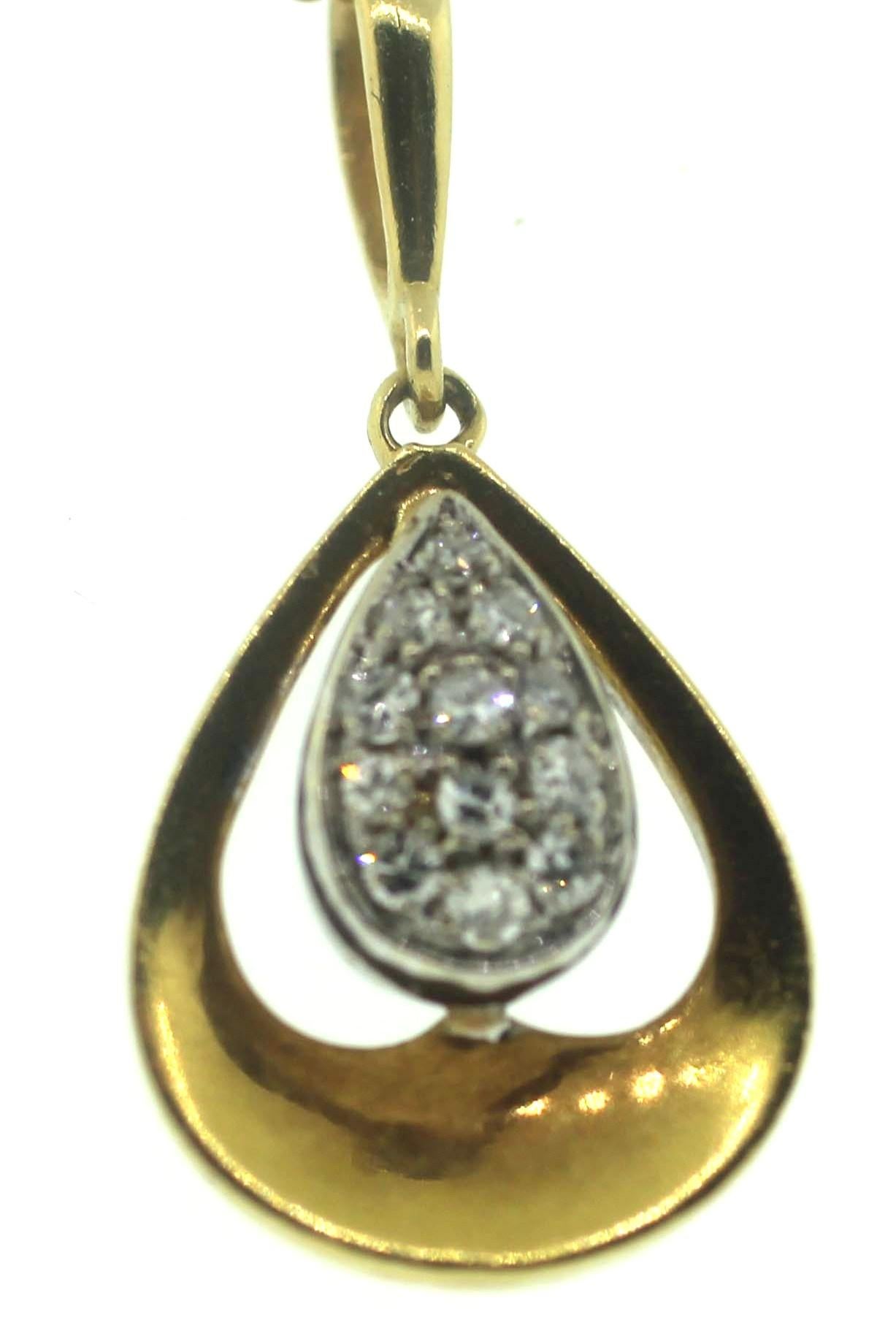 Jewel Of Ocean Diamond Pendent
0.4 Carts
12 Round Brilliant cut. 
18K Yellow Gold
Measurements: Band Width 4.1mm, Ornament Width 18.1mm, Ornament