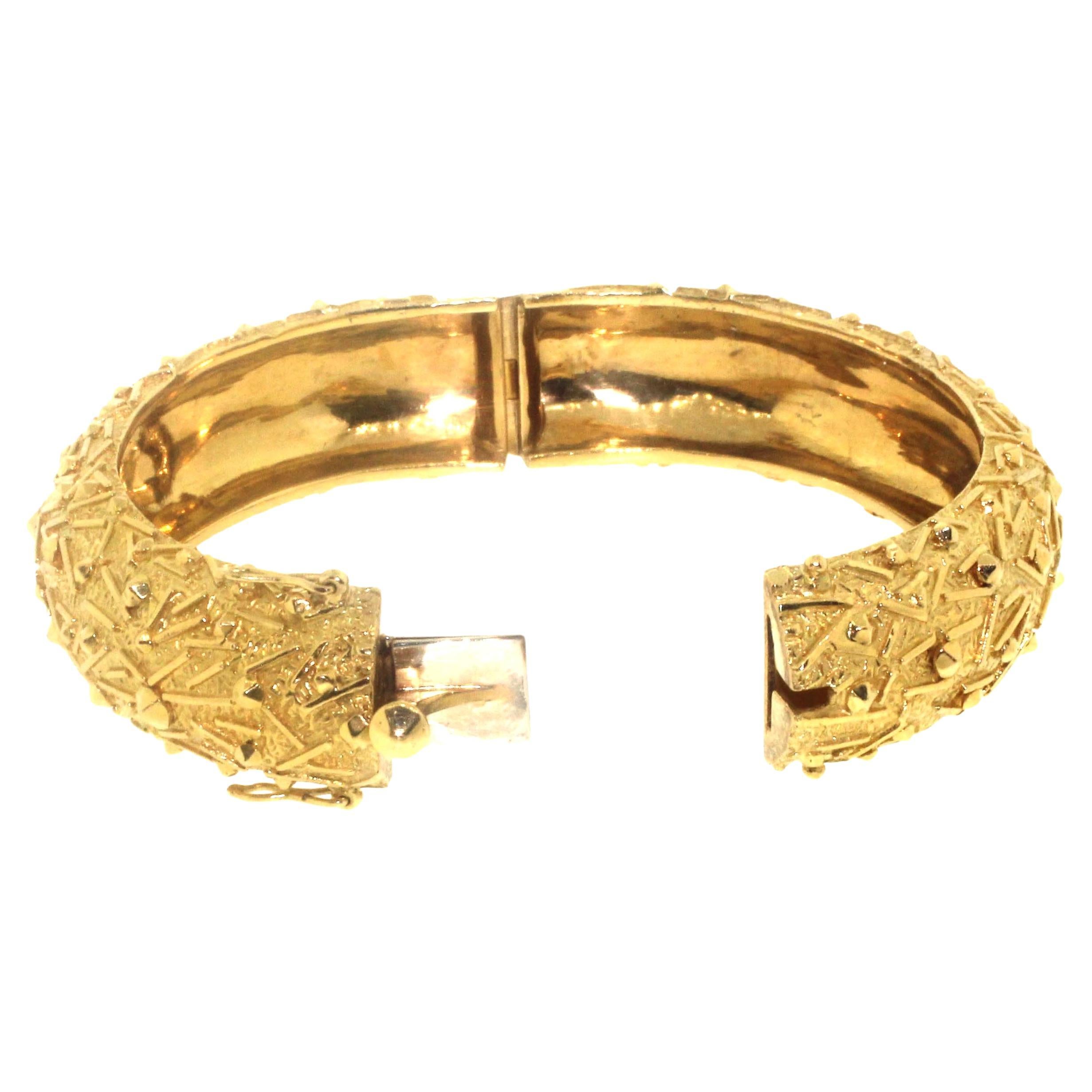 Jewel Of Ocean Estate Bangle Bracelet
18K Yellow Gold  
Weight (g): 61.4
Maker: Estate
Signature: 18K Italy TI  FFA  NY
Estimated Manufactures Retail Price: $35,200
Excellent  Condition
Length 2.5