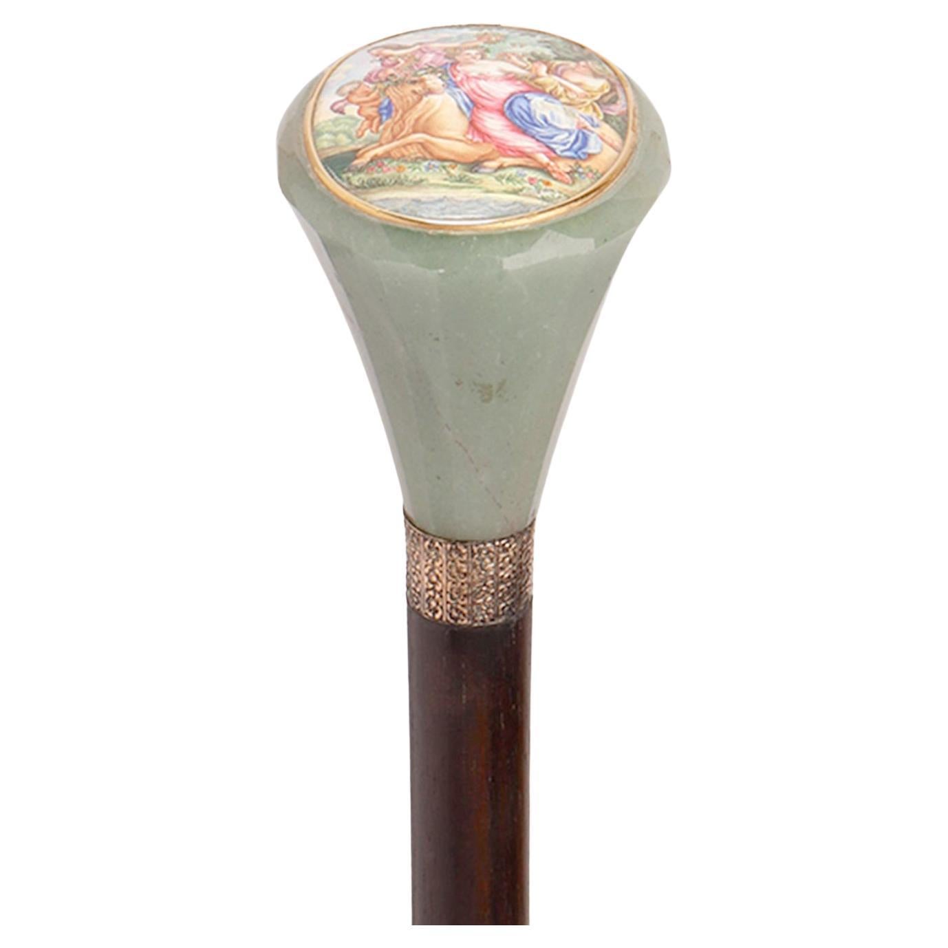 Walking Stick knob made out of green quartz semi-precious stone, oval enamel miniature painted on copper, depicting the rape of Europa and the bull. 18K gold ring and miniature frame. Rosewood shaft. Metal tip. France circa 1870. 