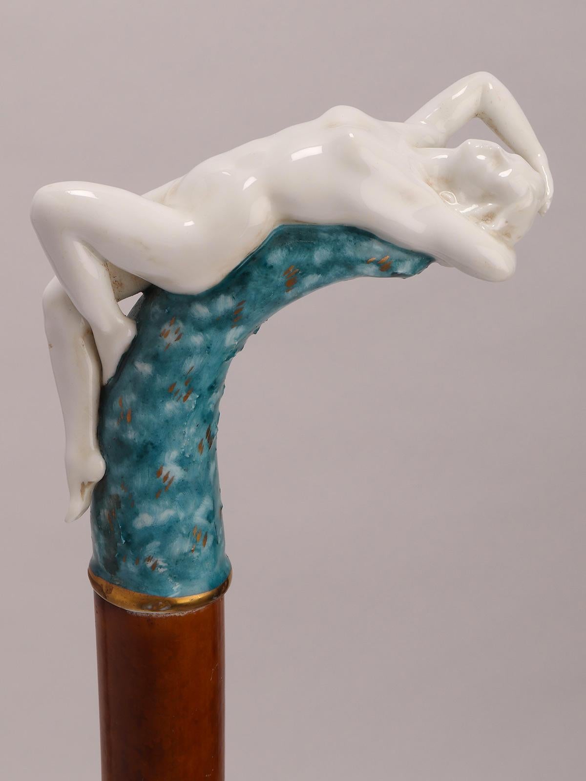 Porcelain Jewel porcelain walking stick depicting a naked lying woman, Italy 1890.  For Sale
