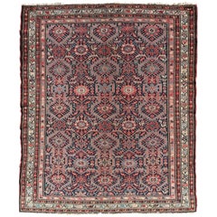 Malayer persan ancien de couleur bijou avec motif géométrique sur toute sa surface