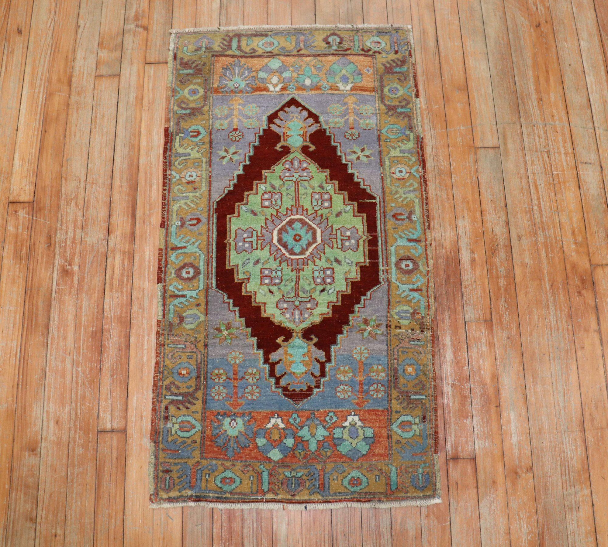 Rich colors highlight this antique Turkish Yastik rug from the early stages of the 20th century

Measures: 23