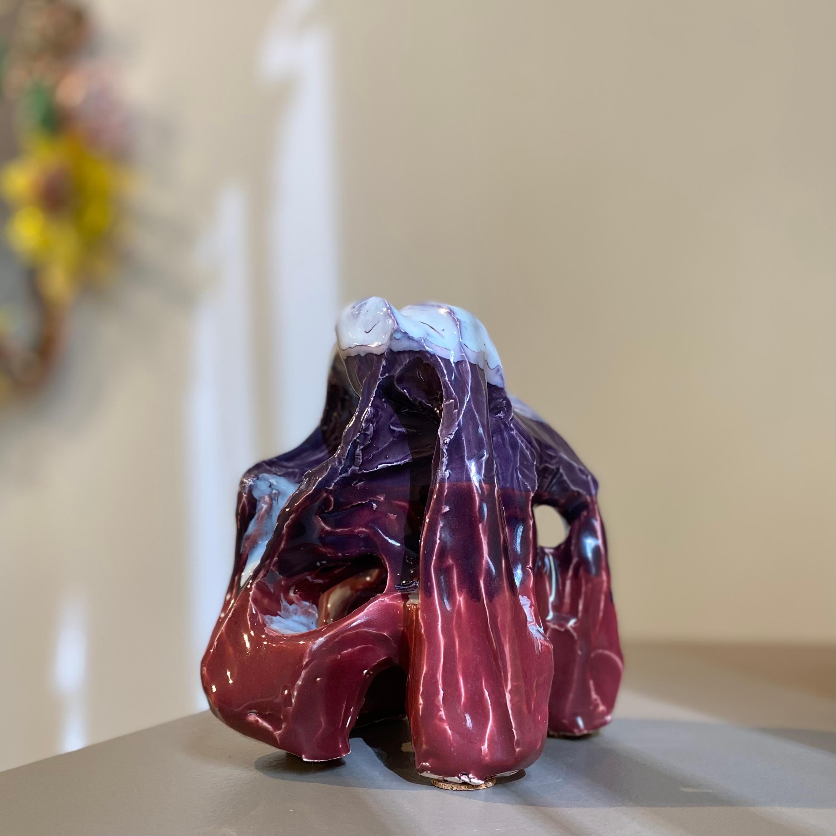 Contemporary ceramic tabletop sculpture hand-built of whiteware clay, and finished in a vibrant, glossy color-blocked glaze of deep purple and burgundy, topped by a pale violet and white ombré-like blend. A unique, hand-crafted decorative object