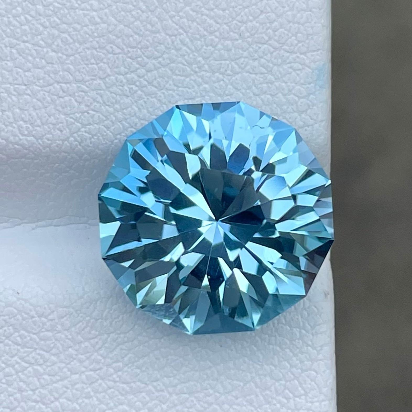 Weight 12.10 carats 
Dimensions 14.1 x 14.0 x 9.72 mm
Treatment Heated 
Clarity Loupe Clean
Origin Madagascar 
Shape Round 
Cut Honey-Comb


Discover the Exquisite Beauty of a 12.10 Carat Natural Honey Comb Swiss Blue Topaz Gemstone from Madagascar.