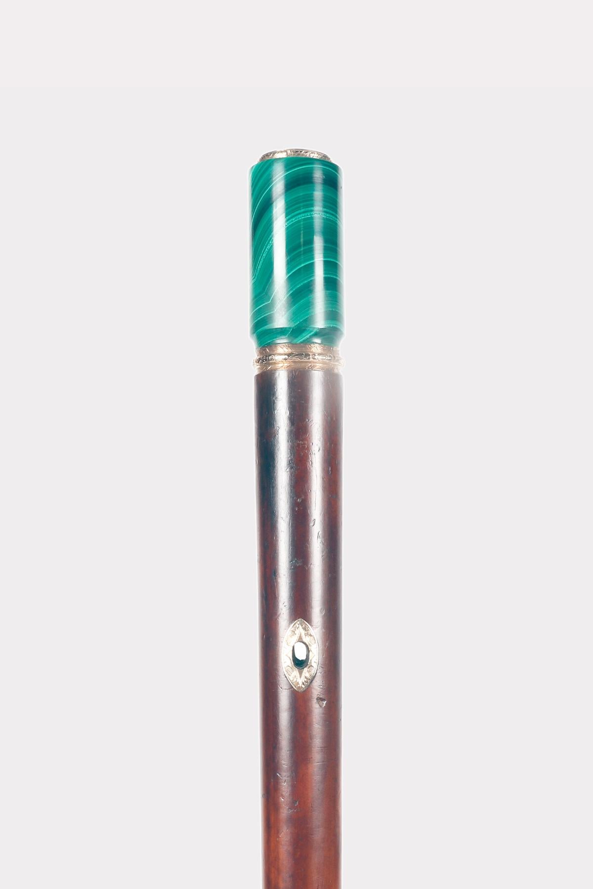 Walking stick: jeweled stick, milord-shaped knob with gold band and malchite cylinder with iron noble seal. Malacca wood barrel with 18K gold eyelets for wrist cord. Horne ferrule. Signed Gabriel Falguieres.
Gabriel Falguières created excellent Art