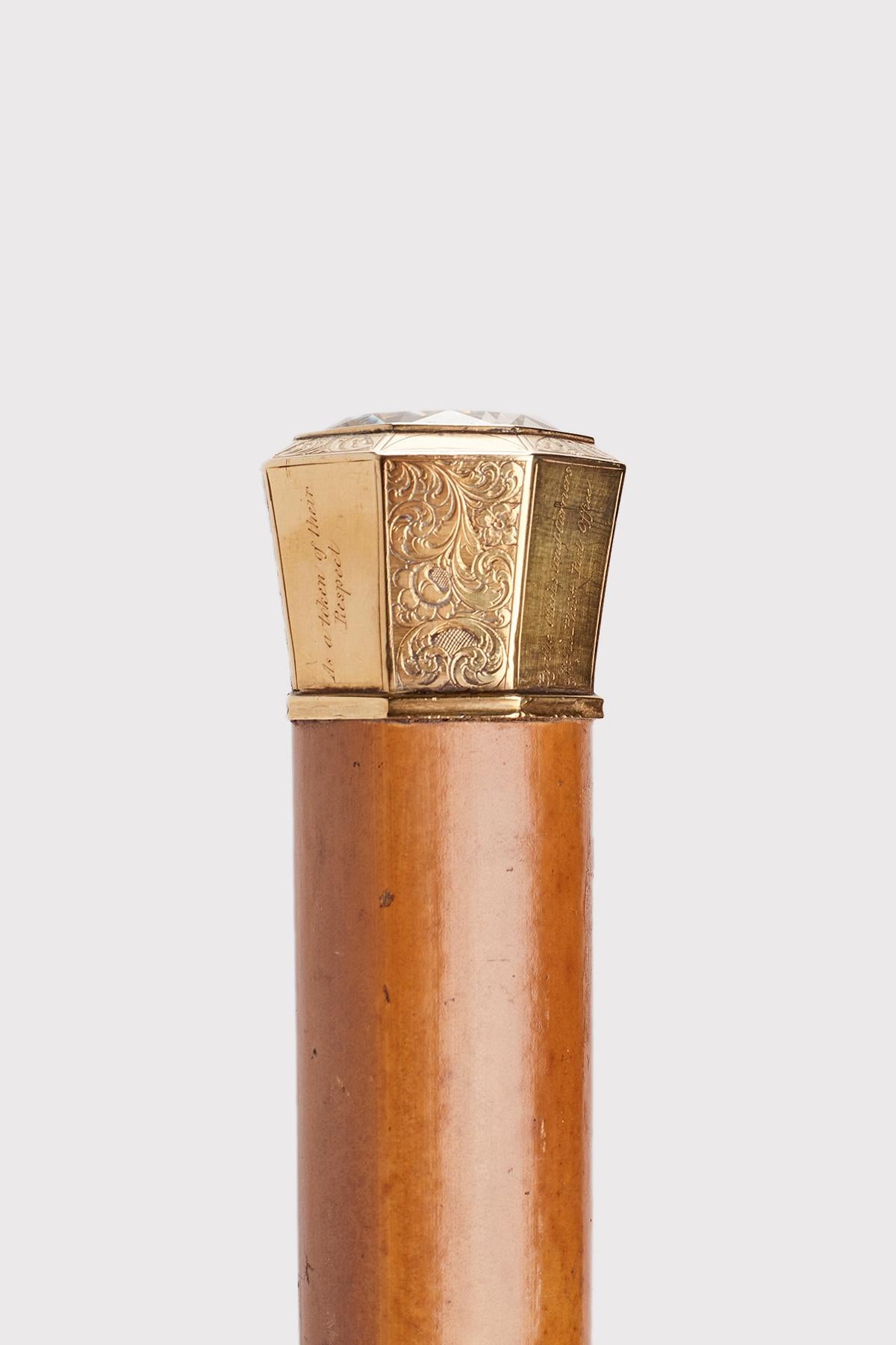 Walking stick: jewel knob handle in the shape of Milord octagonal gold with a large faceted quartz. Malacca wood shaft. Metal ferrule. USA 1841.