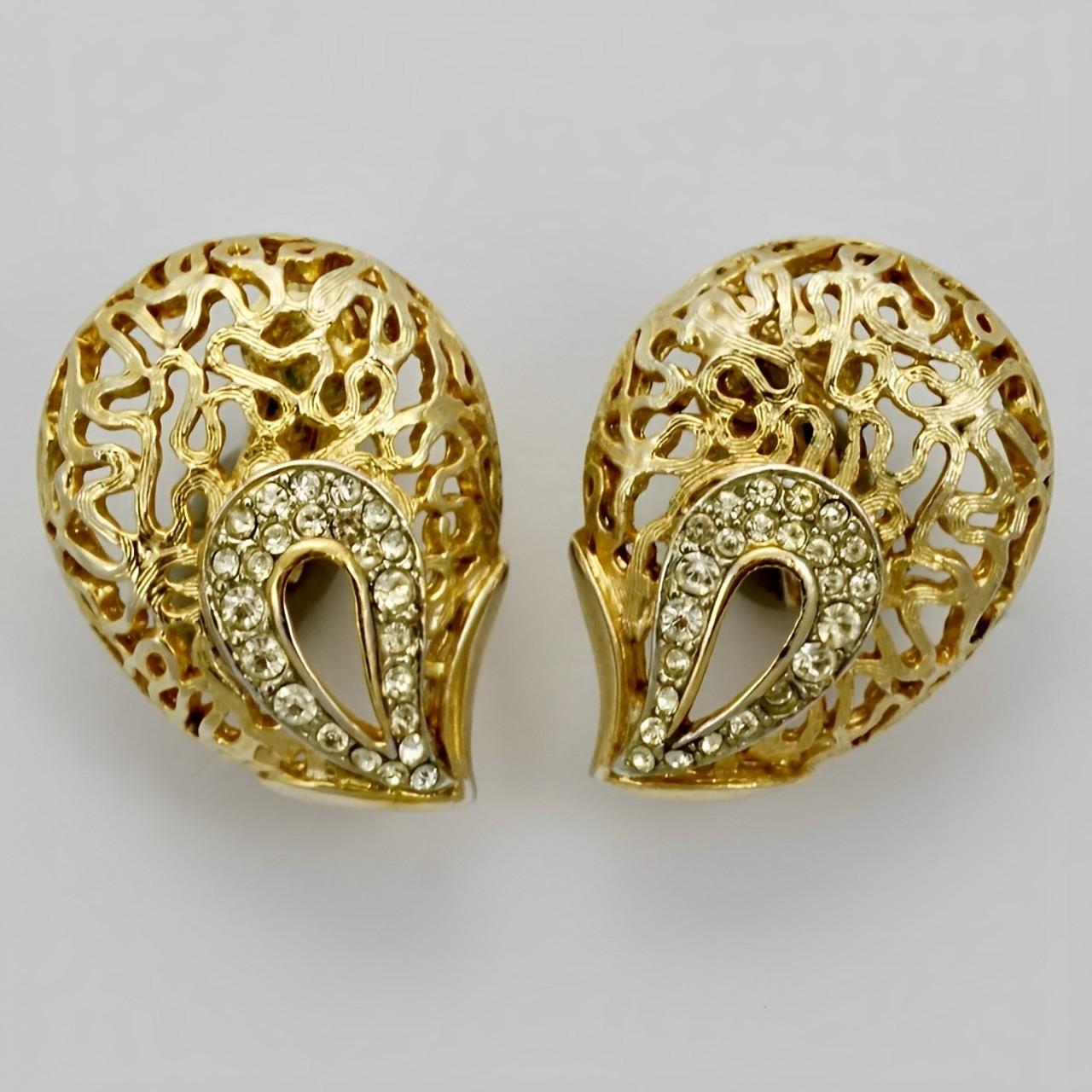 Jewelcraft gold plated textured brooch and clip on earrings, set with rhinestones. The brooch measures 5.4 cm / 2.1 inches by 4.3 cm / 1.7 inches. The earrings are 2.7 cm / 1 inch by 2 cm / .78 inch. There is some wear to the gold plating, and some