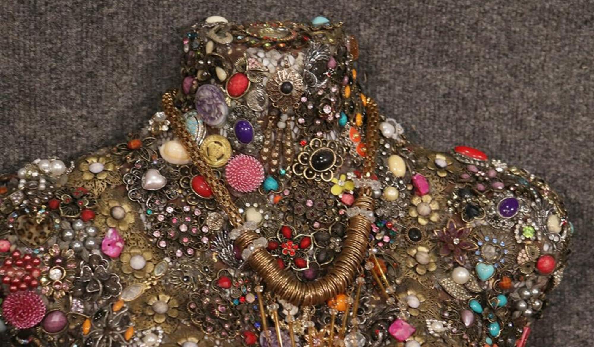 This is a rare and unique artistic representation of a human torso. The torso is bejeweled in various jewels, pins, watches and interesting things to add bling and character to the piece. This is an art piece. It measures: 30 tall x 17 wide x 5 deep