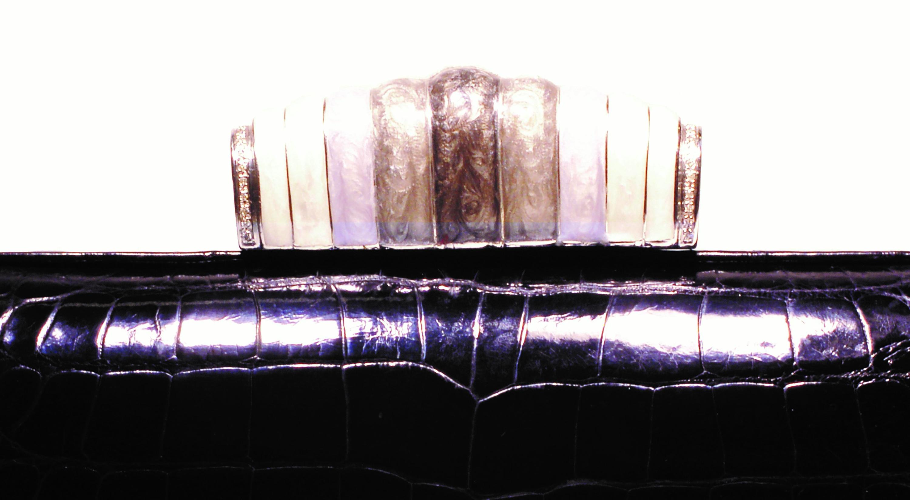 One of a kind, 20th-century sterling silver Guilloché enamel clasp, and black alligator exotic skin Minaudière
Enameled pearlized silver clasp pave set with 2.24 carats of diamonds
14