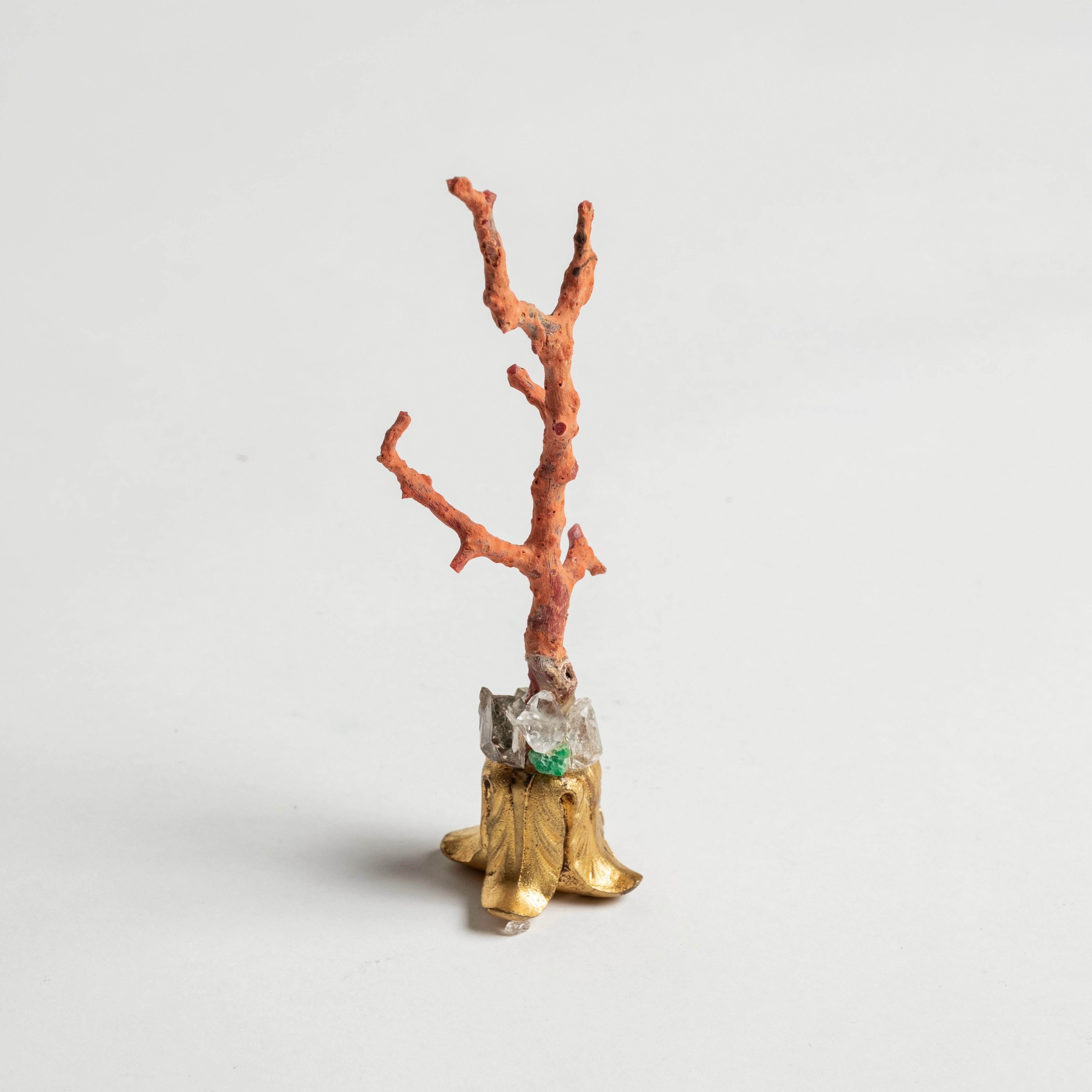 Red coral branch embellished with natural emeralds and quartz mounted on a 19th-Century French bronze doré fragment. This is a lovely objet d'art to add to your collection or cabinet.

During the Renaissance, Cabinets of Art and Curiosity were