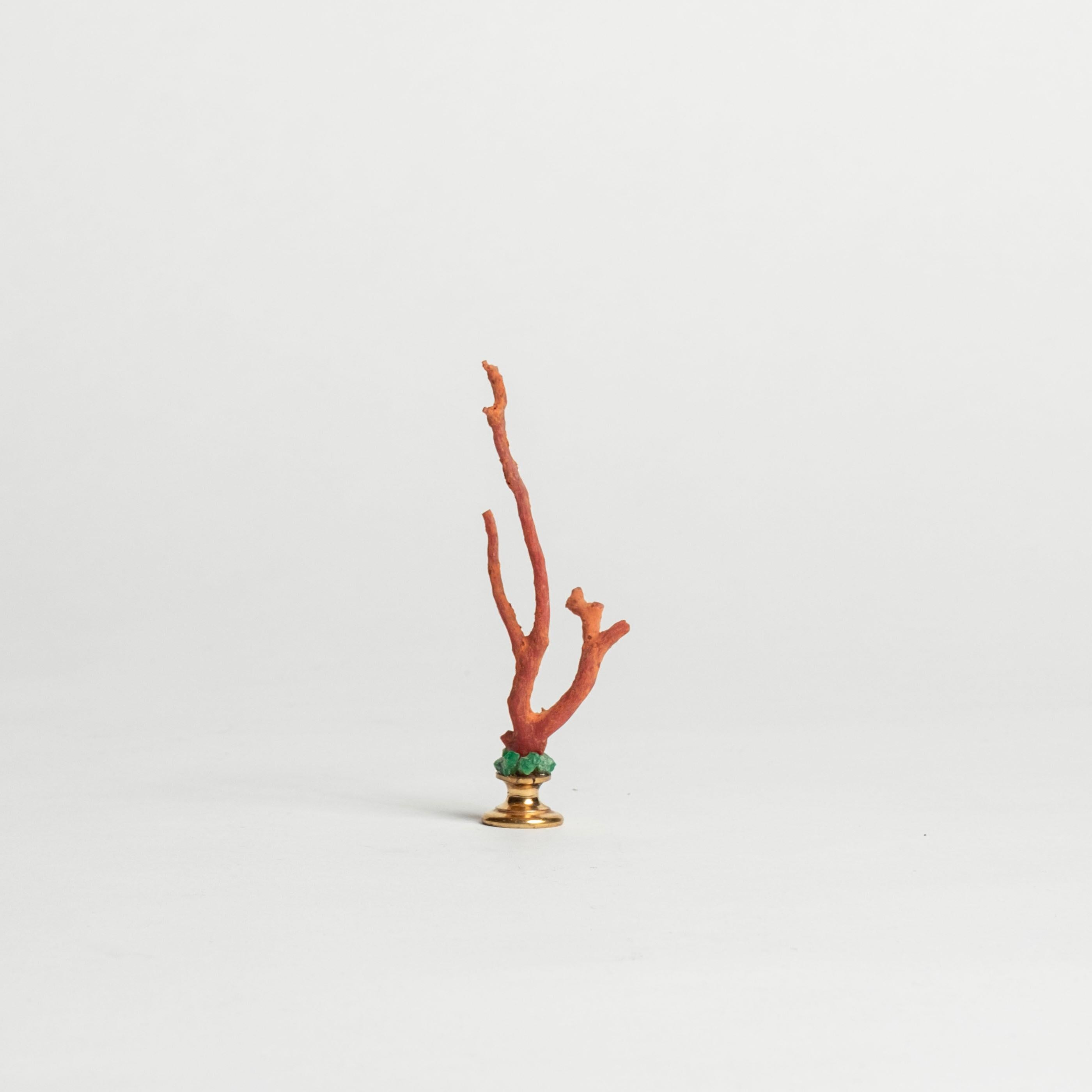 Red coral branch embellished with natural emeralds mounted on a 19th-Century French bronze doré fragment. This is a lovely objet d'art to add to your collection or cabinet.

During the Renaissance, Cabinets of Art and Curiosity were developed for