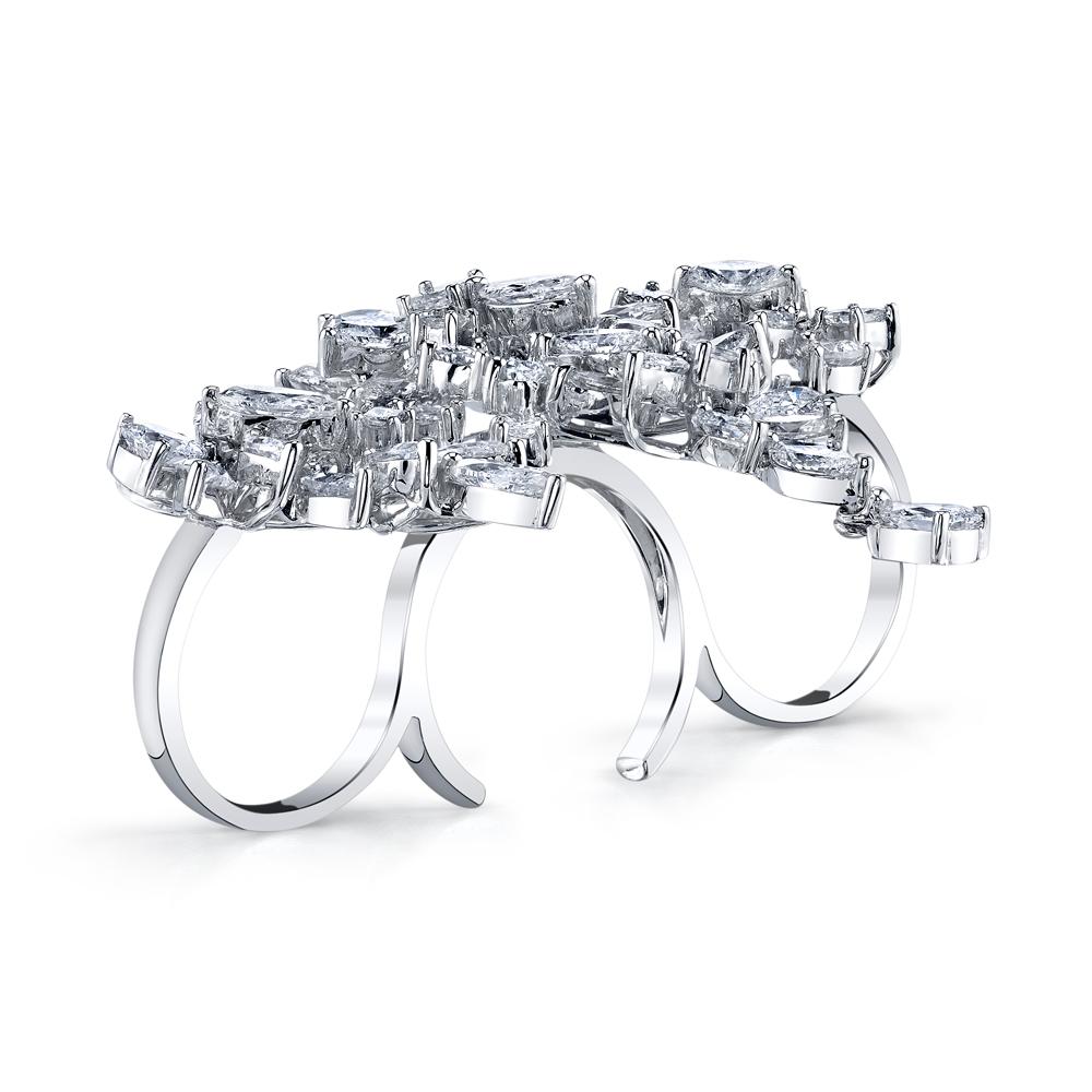 A fun and sexy ring designed to be worn on the 3 center fingers, it features 13.22 carats of multi shaped diamonds set in 14k white gold. 

Dimensions: 2.40 x 1.80 inch
Sizable