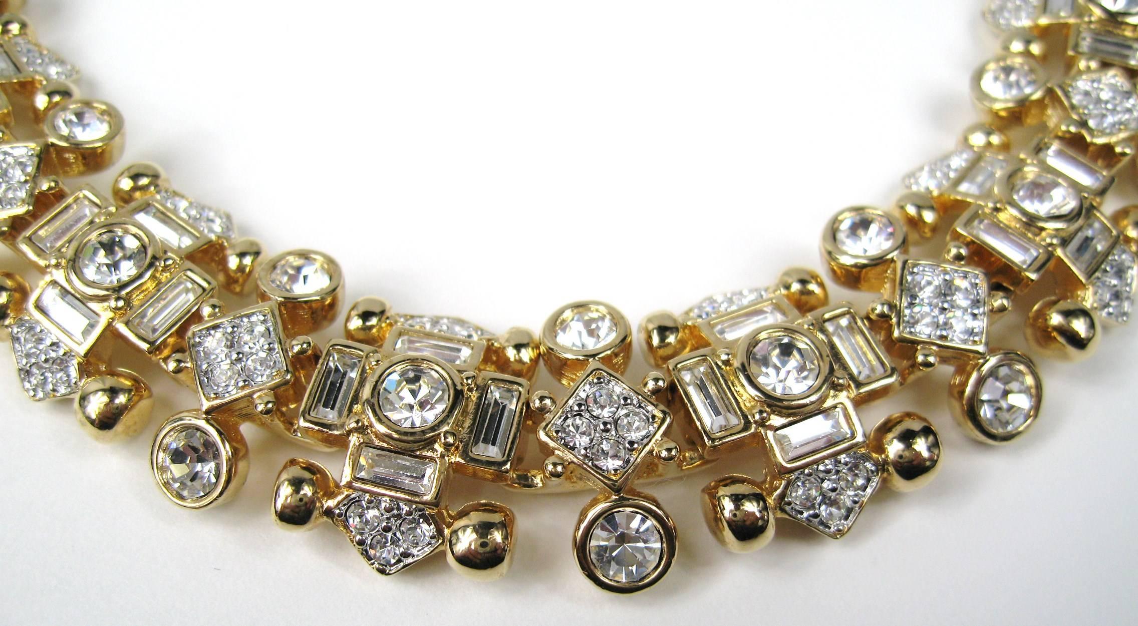 Stunning is what this is!. Look at the photo's! New, never worn! The sparkle on this necklace spectacular. 1980s Swarovski. Links of  Gilt Gold with bezel set Swarovski crystals- Rounds Rectangular. It has a added link with double fold over clasps.