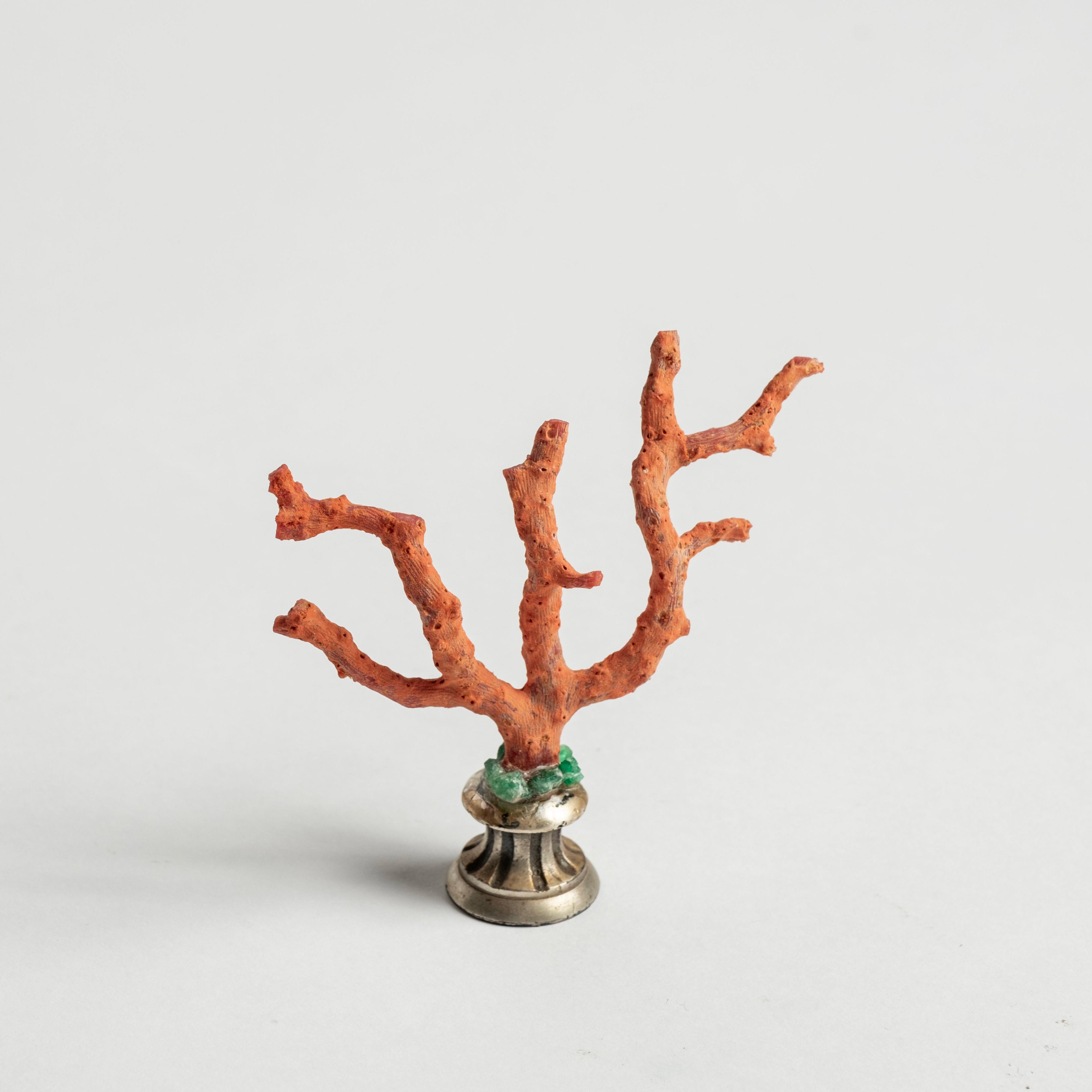 Red coral branch embellished with natural emeralds mounted on a 19th-Century French white bronze fragment. This is a lovely objet d'art to add to your collection or cabinet.

During the Renaissance, Cabinets of Art and Curiosity were developed for