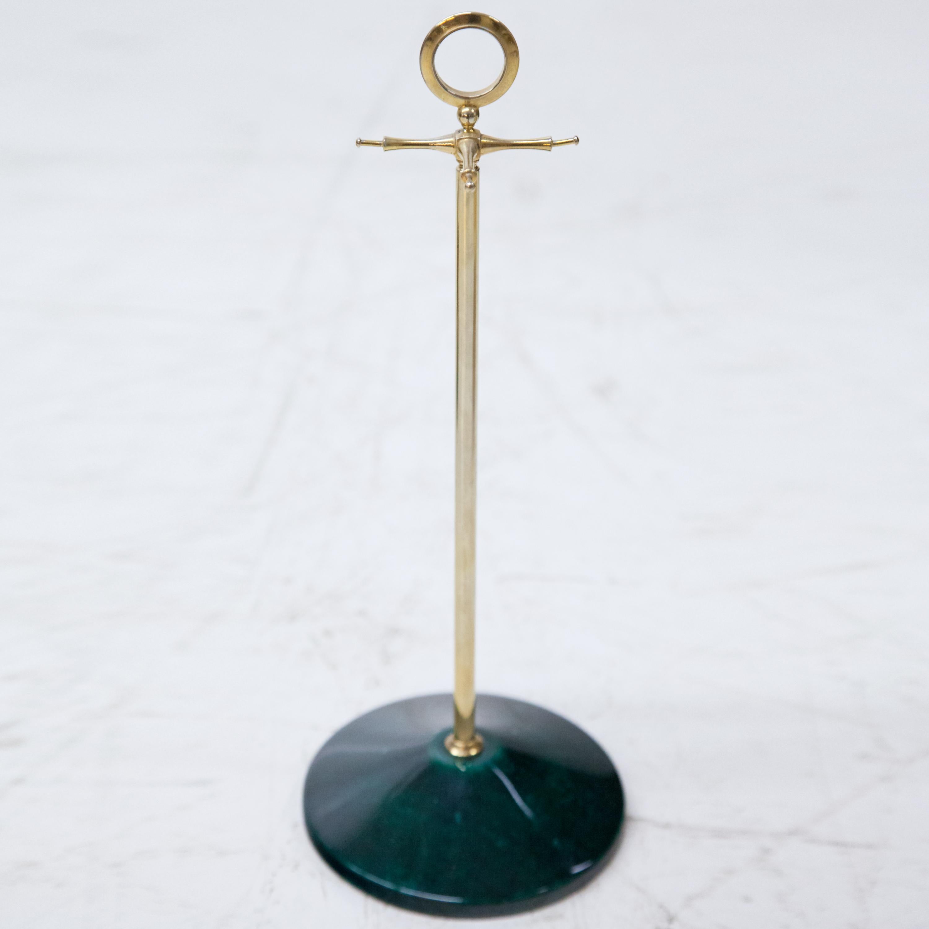 Jewelry stand for necklaces on round green stand covered with goatskin and clear lacquer. Label of Tura Milano Italia on the bottom.