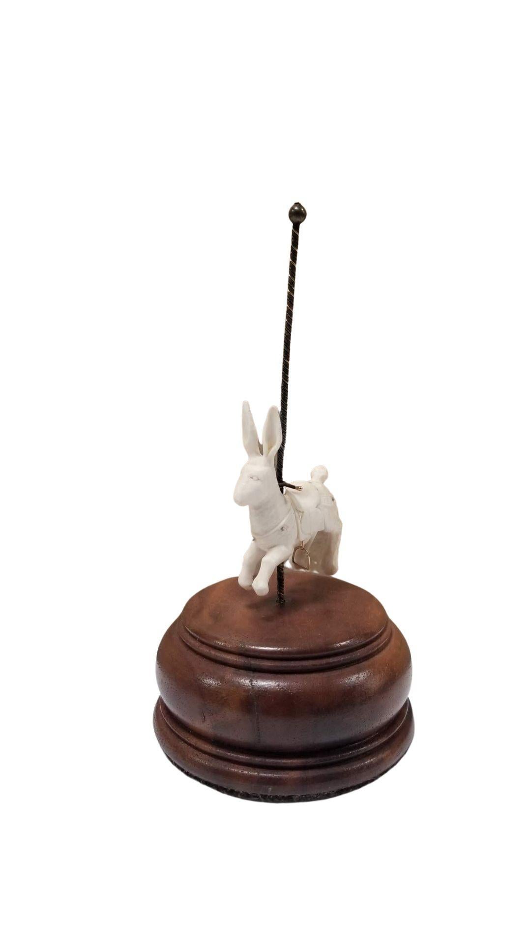 Handmade carving of a carousel rabbit carved out of bone by jewelry artist Chris Miller from his Pal Moon studio. Can be used as a ring and jewelry stack stand.
Signed: Chris Miller 1980