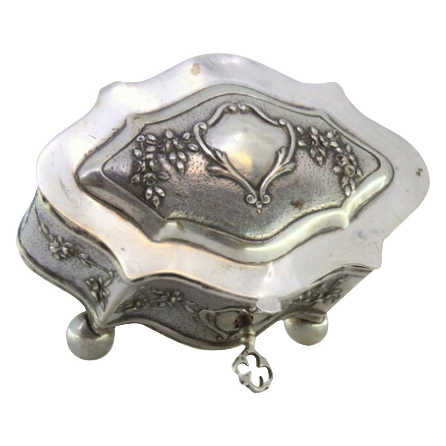 Jewelry box, in embossed silver with floral motifs surrounding the card