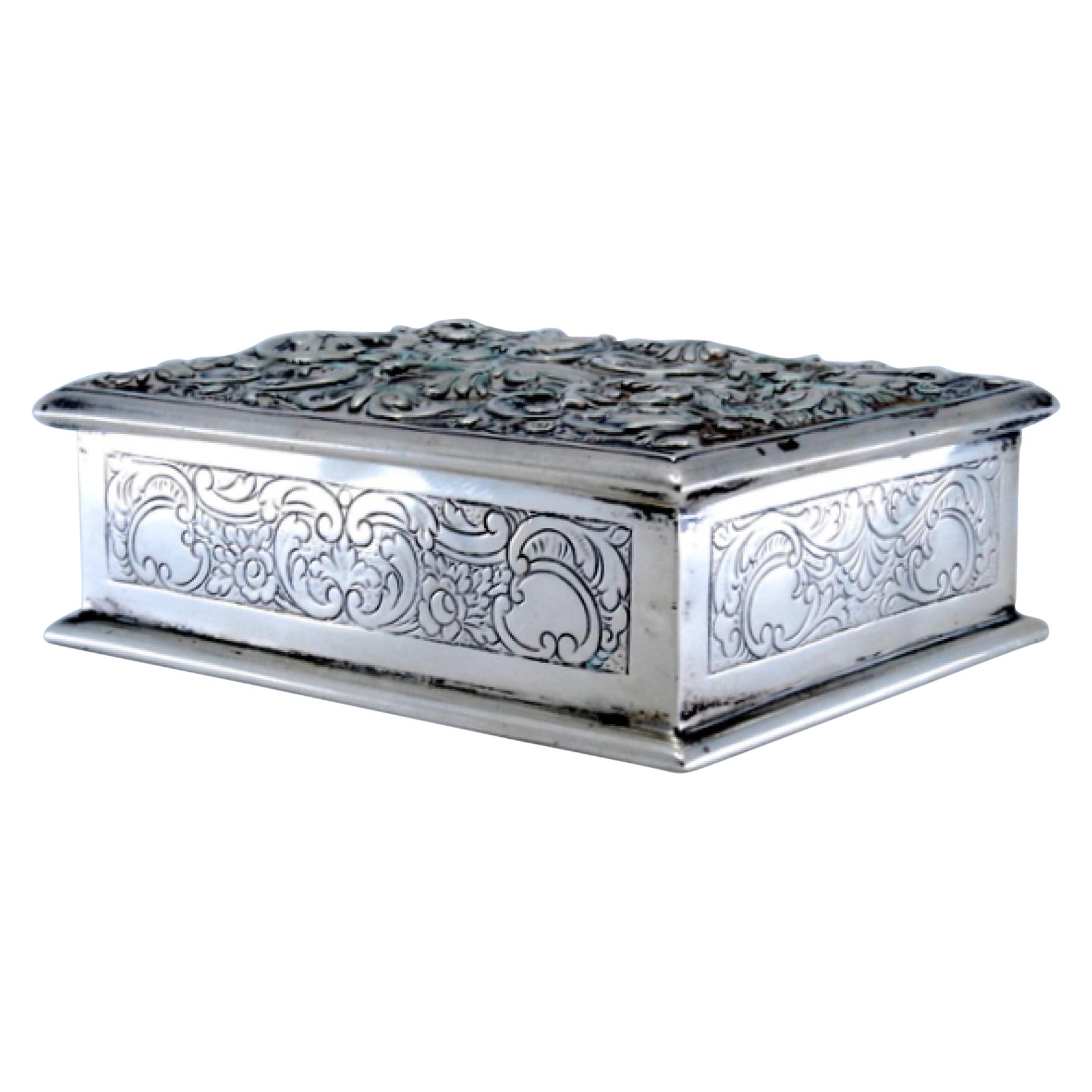 Jewelry box in embossed silver with scrolls and plant motifs