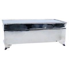 Jewelry box, in guilloche silver w/ a monogram card 
pearl trim around the edge