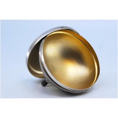 Jewelry box in matte silver with three raised, beaded feet and a removable lid