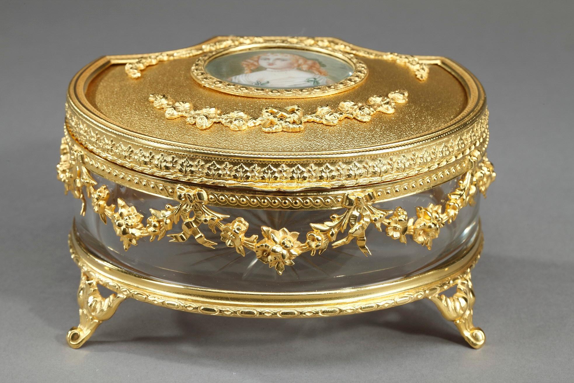 Louis-Philippe jewelry box crafted of crystal and gilt bronze. The ormolu lid chiseled with garlands of roses, is decorated with a miniature featuring Madame de Sévigné. Marie de Rabutin-Chantal, marquise de Sévigné (1626-1696) was a French