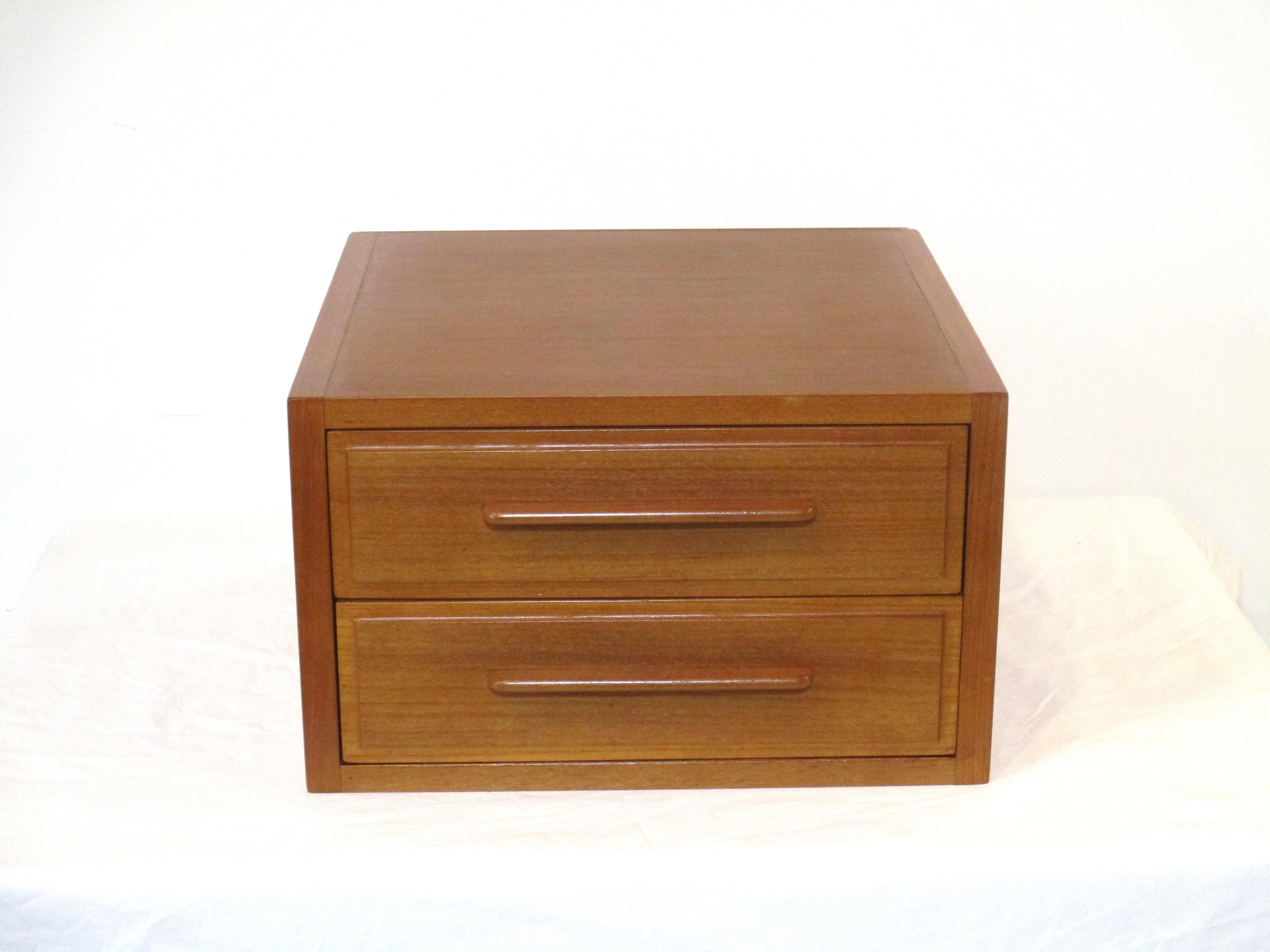 A two drawer dresser top or closet teak wood jewelry / watch box with slender matching pulls. The drawer bottoms are lined in felt to protect your items, a nice size for our everyday jewelry designed and manufactured by H.P. Hansen Mobler Denmark.