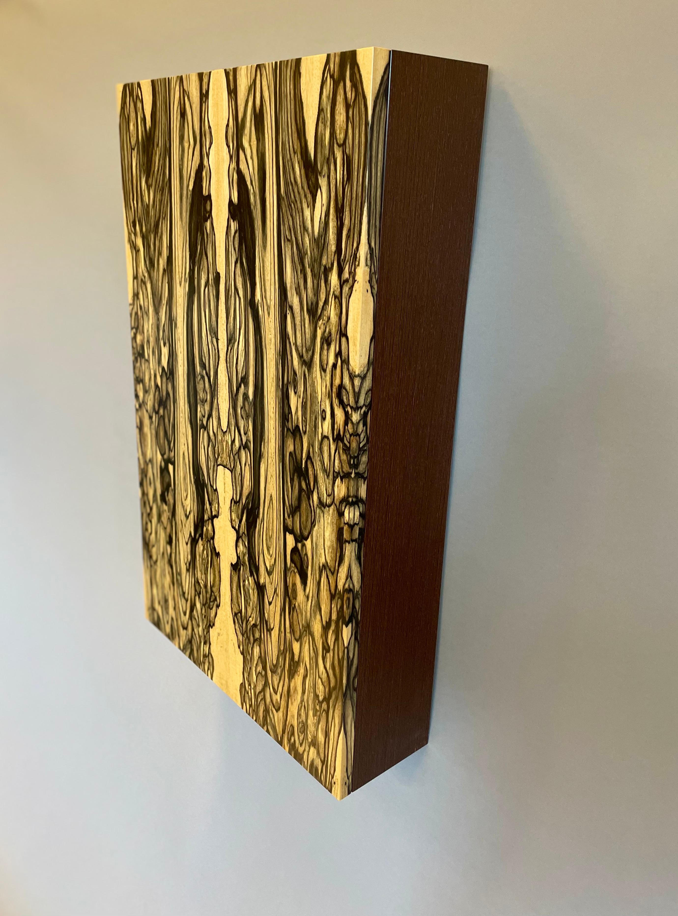 Jewelry Case ONE celebrates material & minimal design. At first glance it appears as a stunning wall piece, subtly inviting a closer study. Upon doing so one finds 
a door held shut by a tiny magnet, easily opened with a gentle pull to the edge. The