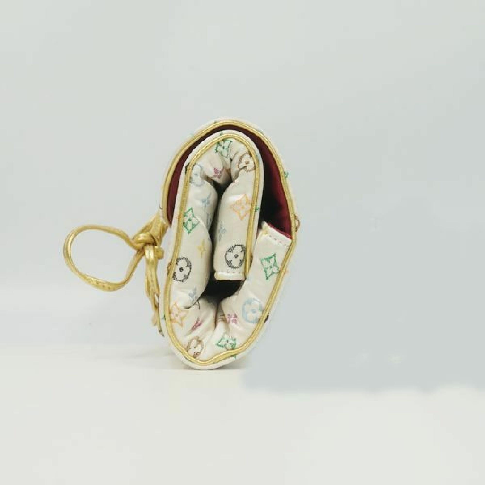 An authentic jewelry case  Trousse  Bijoux  Pliable  Other accessories M92047  multi color. The color is multi color. The outside material is Monogram satin. The pattern is Trousse  Bijoux  Pliable. This item is Vintage / Classic. The year of