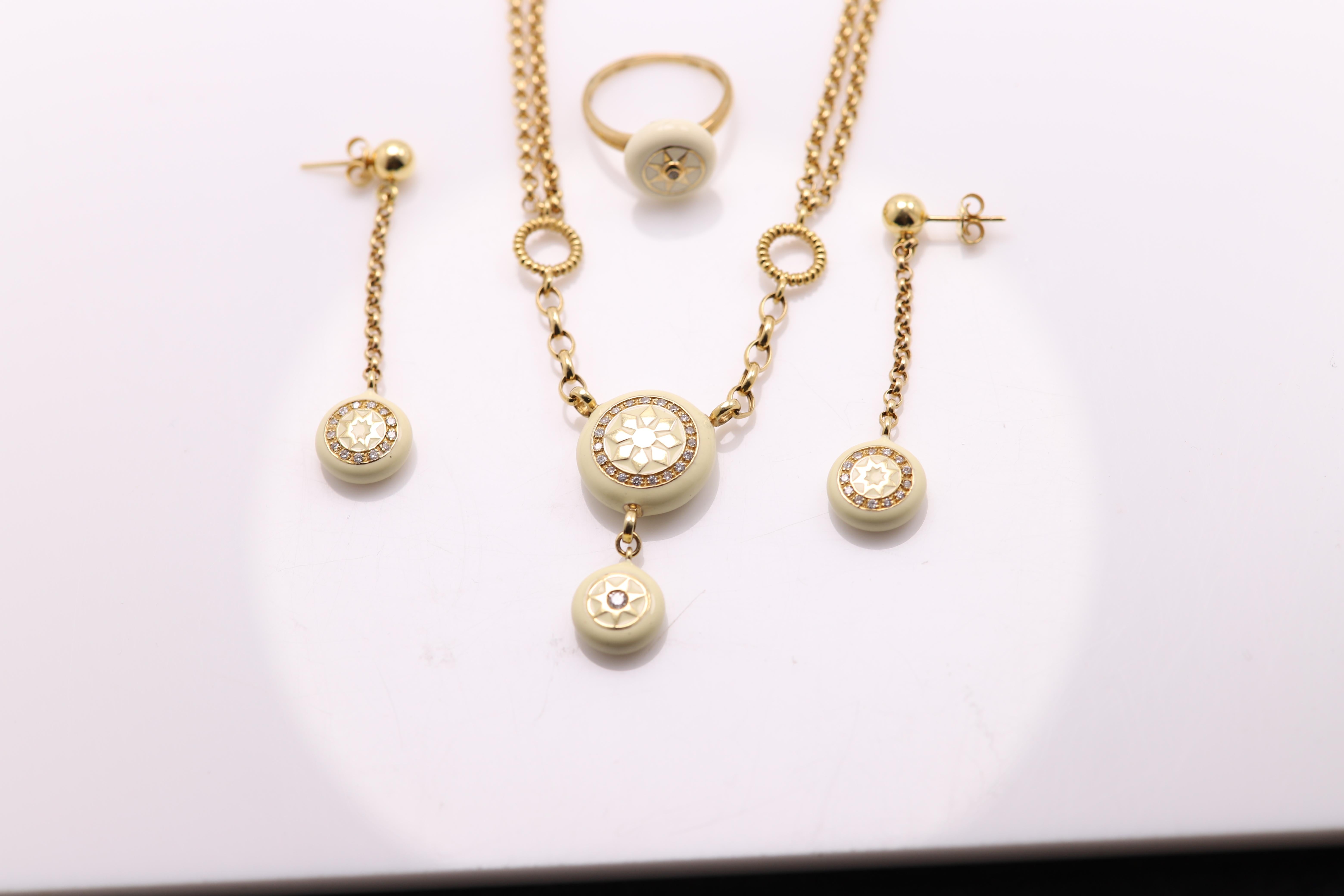 New lovely jewelry set 
14k yellow gold
Natural Diamonds total 0.55 carat G-SI 
Enamel Color is white-ish a bit off-white 
made in italy
the earrings are 2' Inch long
The Ring is size 7.5 
the Necklace is 15' Inch Long
can be adjusted according to