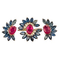 Jewelry set: earrings and ring with rubies and sapphires in 14k gold. 