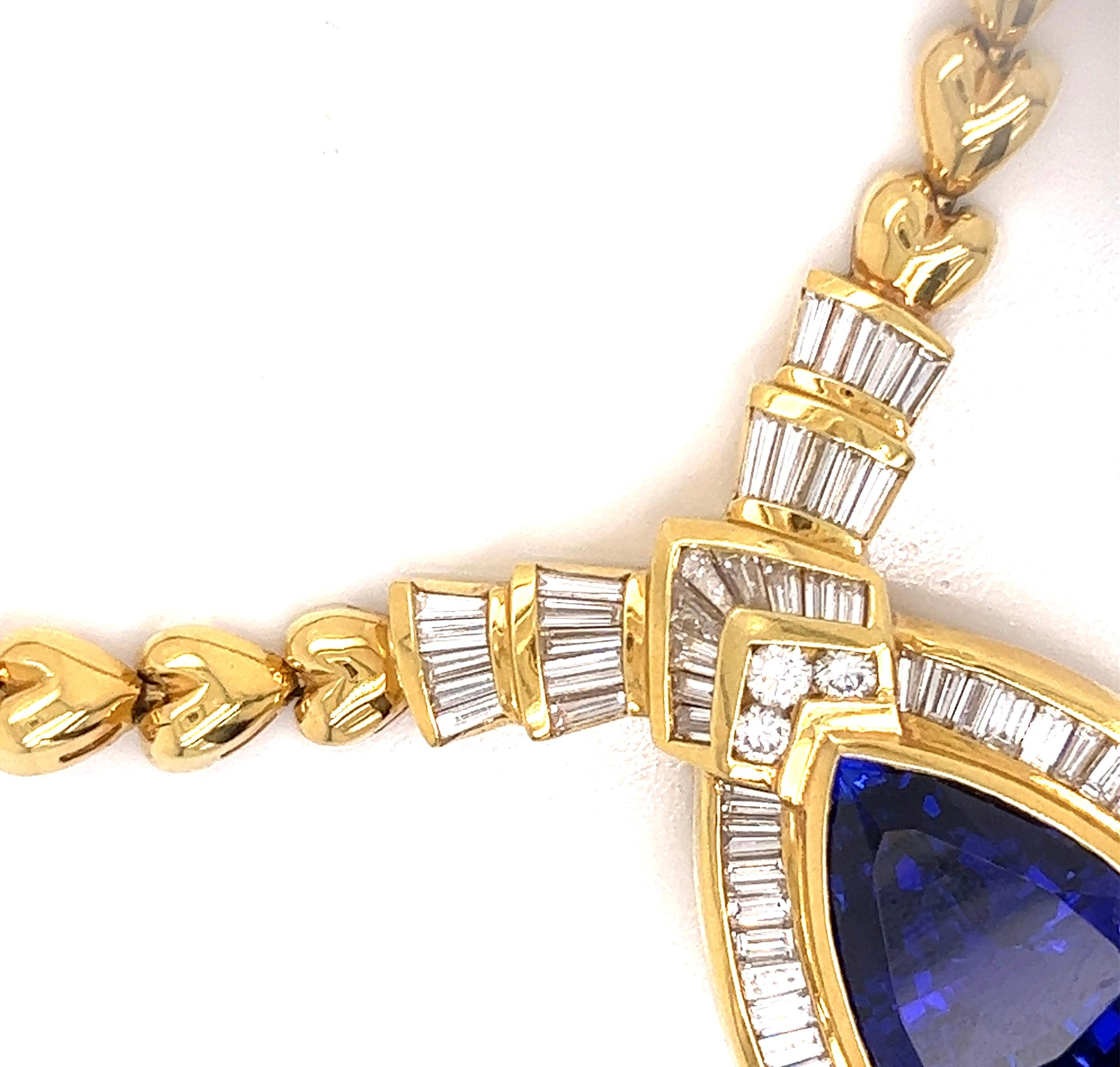 This estate piece is absolutely fabulous.  This Jewels By Star tanzanite necklace has  4.71 cttw in baguette diamonds, VS clarity, F-G color. There are an additional  .48 cttw round brilliant diamonds, VS clarity, F-G color.  With 92 Grams of 18 Kt