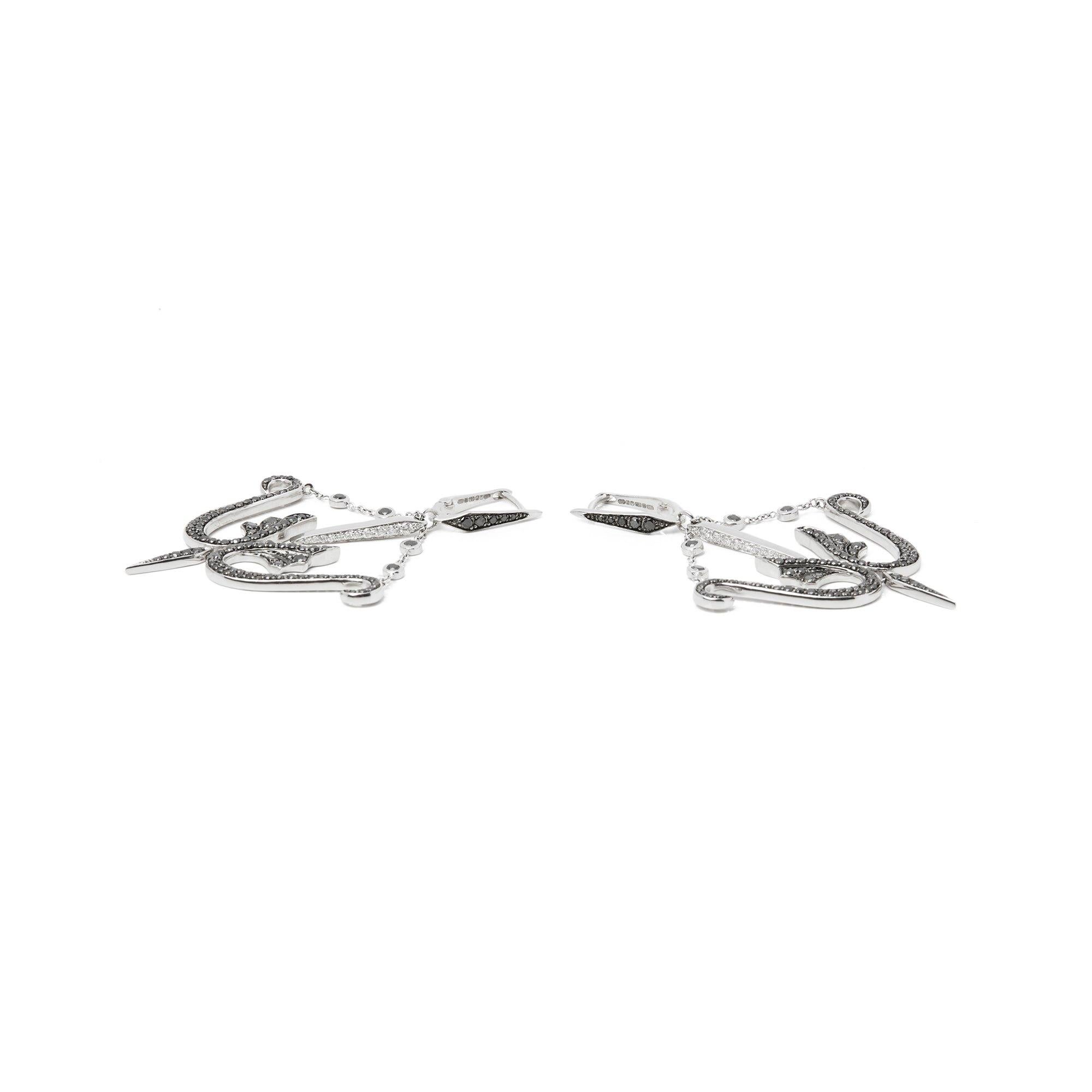 These earrings by Stephen Webster are from his Jewels Verne collection and feature pave set black and white diamonds. Set in 18k white gold and with a leverback fitting. 
