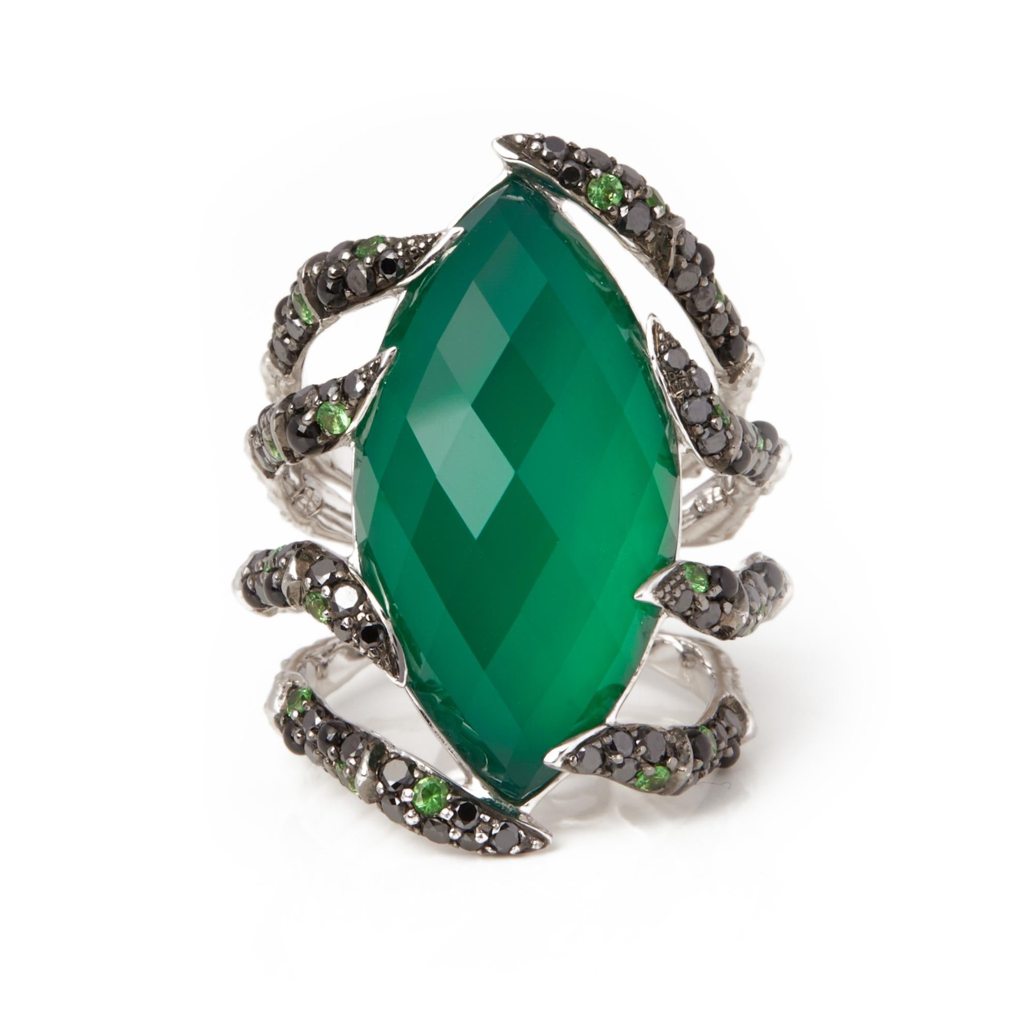 This ring by Stephen Webster is from his Jewels Verne collection and features a green agate Crystal Haze stone complemeted by black diamond and tsavorite stones. Set in white gold with a signature band. Complete with Xupes presentation box. Our