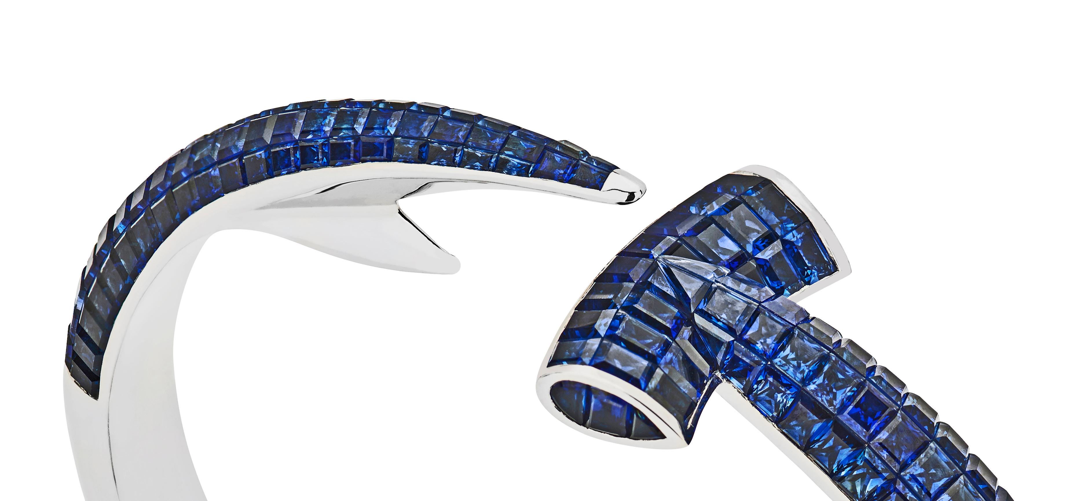 Dive for precious bounty with the Hammerhead Sapphire Bangle. The Hammerhead sapphire bangle combines Webster's love of the aquatic with a sleek silhouette and intricate gem setting.

Hand crafted in 18 karat white gold and completed with square cut
