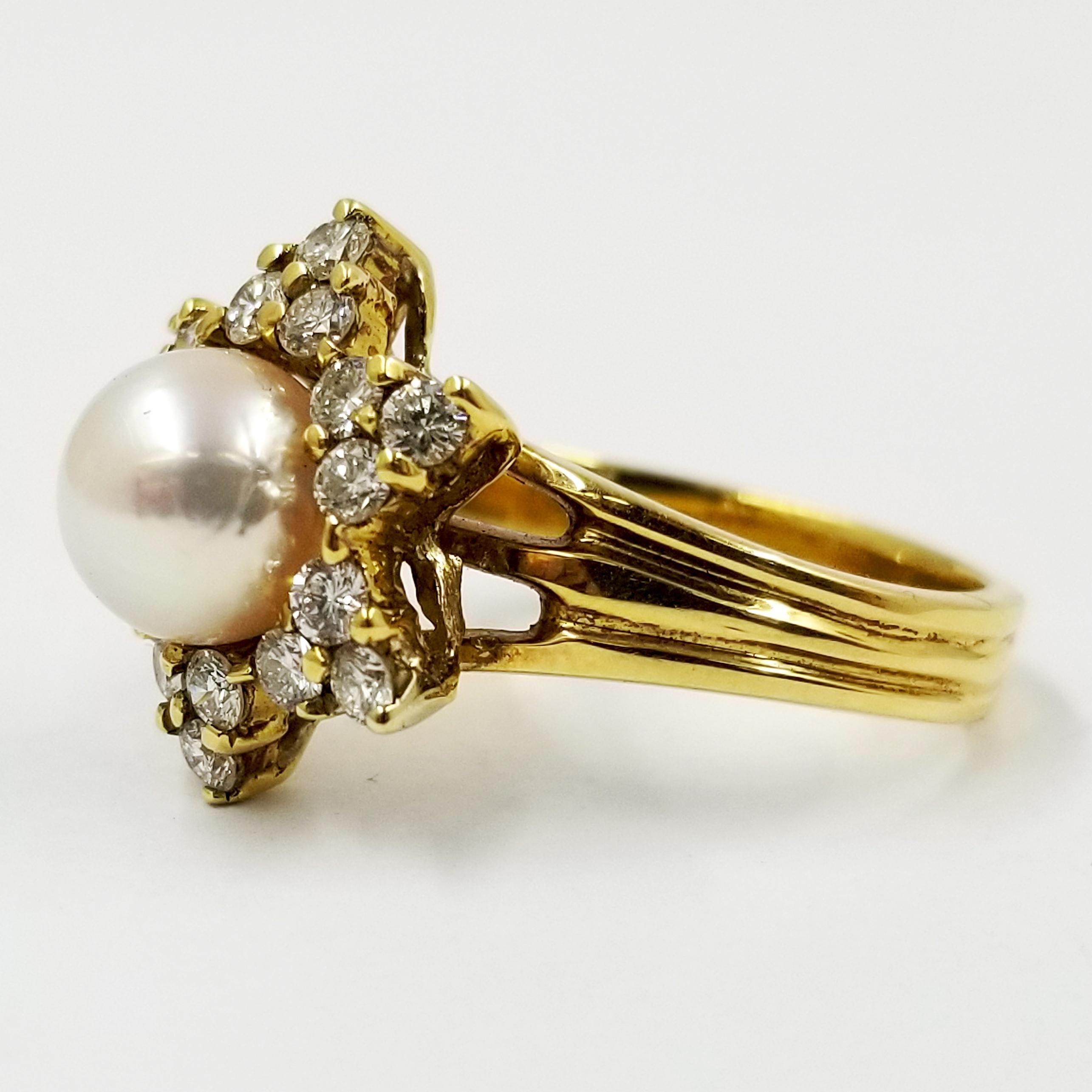 18 Karat Yellow Gold Ring Featuring One White Round Cultured Pearl. The Mounting Contains 18 Prong-set Round Diamonds Totaling Approximately 0.65 Carats of VS Clarity & G Color, in 6 Triangle Shapes Similar to the Star of David. Current Finger Size