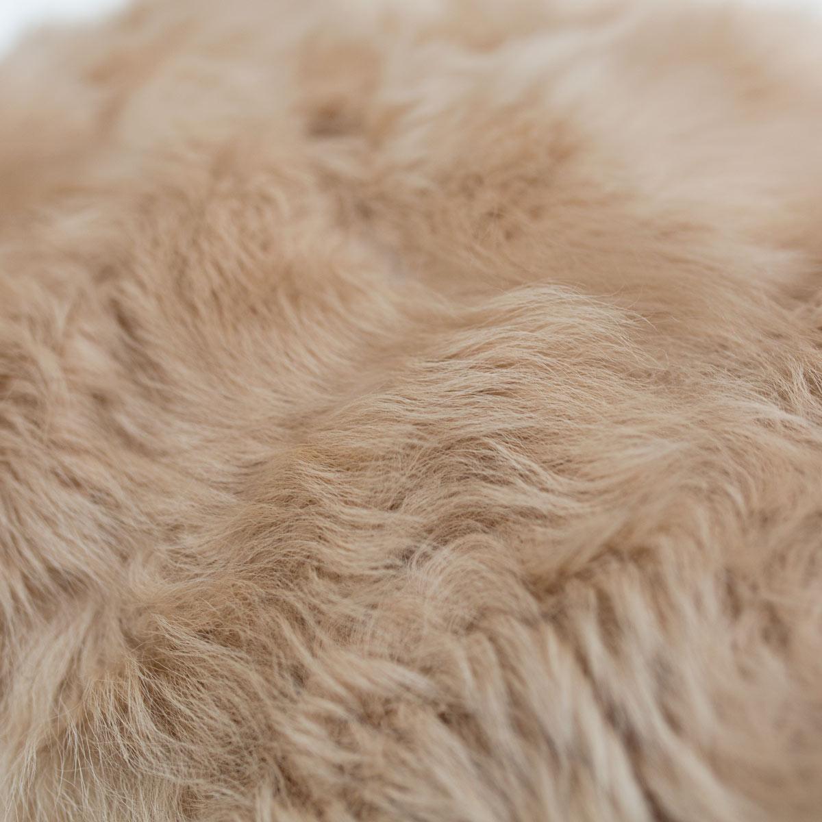 Soft, warm authentic toscana sheep blanket. 100% toscana sheep fur from Spain, this one-of-a-kind piece is sewn from Italian glove company remnants. 

Each piece has its own unique character and no two will be exactly alike. We inspect every inch,